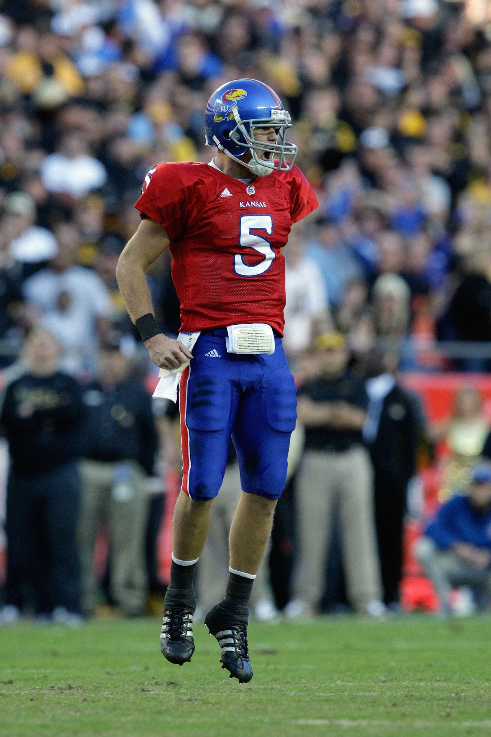 KANSAS CITY, MO - NOVEMBER 28: Quarterback Todd Reesing #5 of the Kansas Jayhawks celebrates during the game against the Missouri Tigers at Arrowhead Stadium on November 28, 2009 in Kansas City, Missouri. (Photo by Jamie Squire/Getty Images)