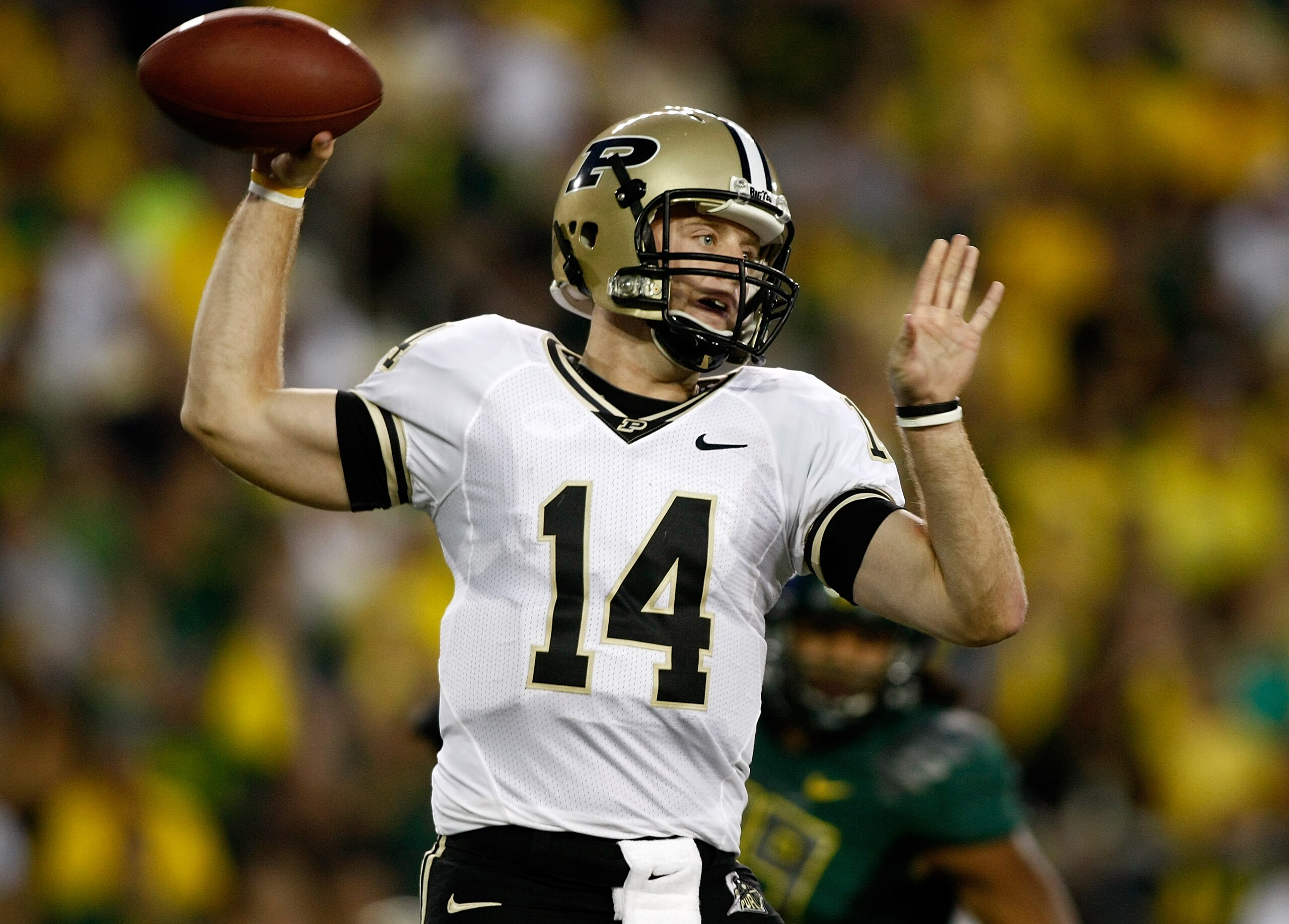 EUGENE, OR - SEPTEMBER 12:  Quarterback Joey Elliott #14 of the Purdue Boilermakers  throws the ball against the Oregon Ducks at Autzen Stadium on September 12, 2009 in Eugene, Oregon.  (Photo by Jonathan Ferrey/Getty Images)