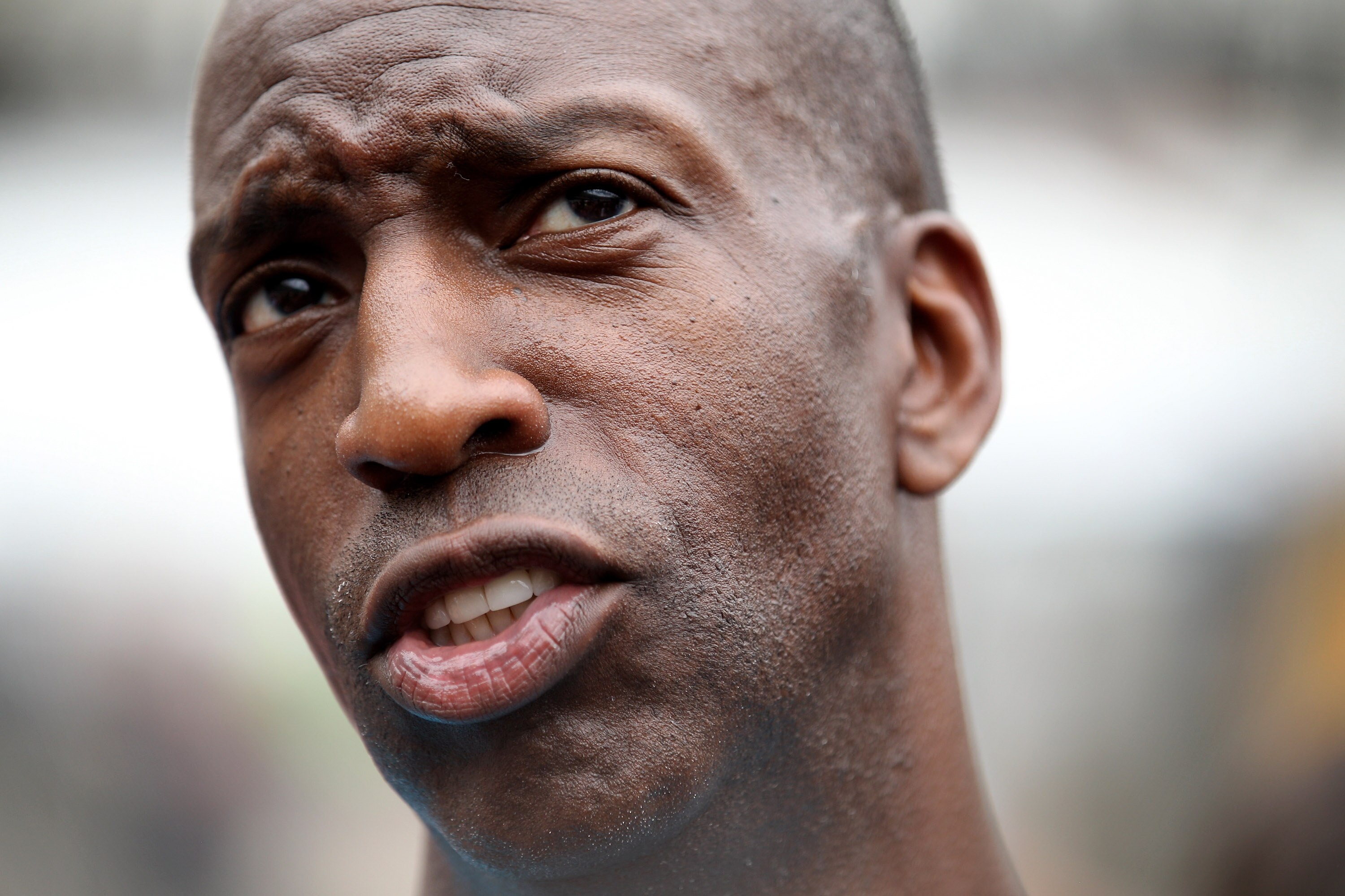 LONDON, ENGLAND - JULY 27:  Michael Johnson, a four-time Olympic gold medalist, is interviewed after runing along a track inside the Olympic Stadium in Stratford on July 27, 2010 in London, England. Today marks two years to go until the London Olympic Gam