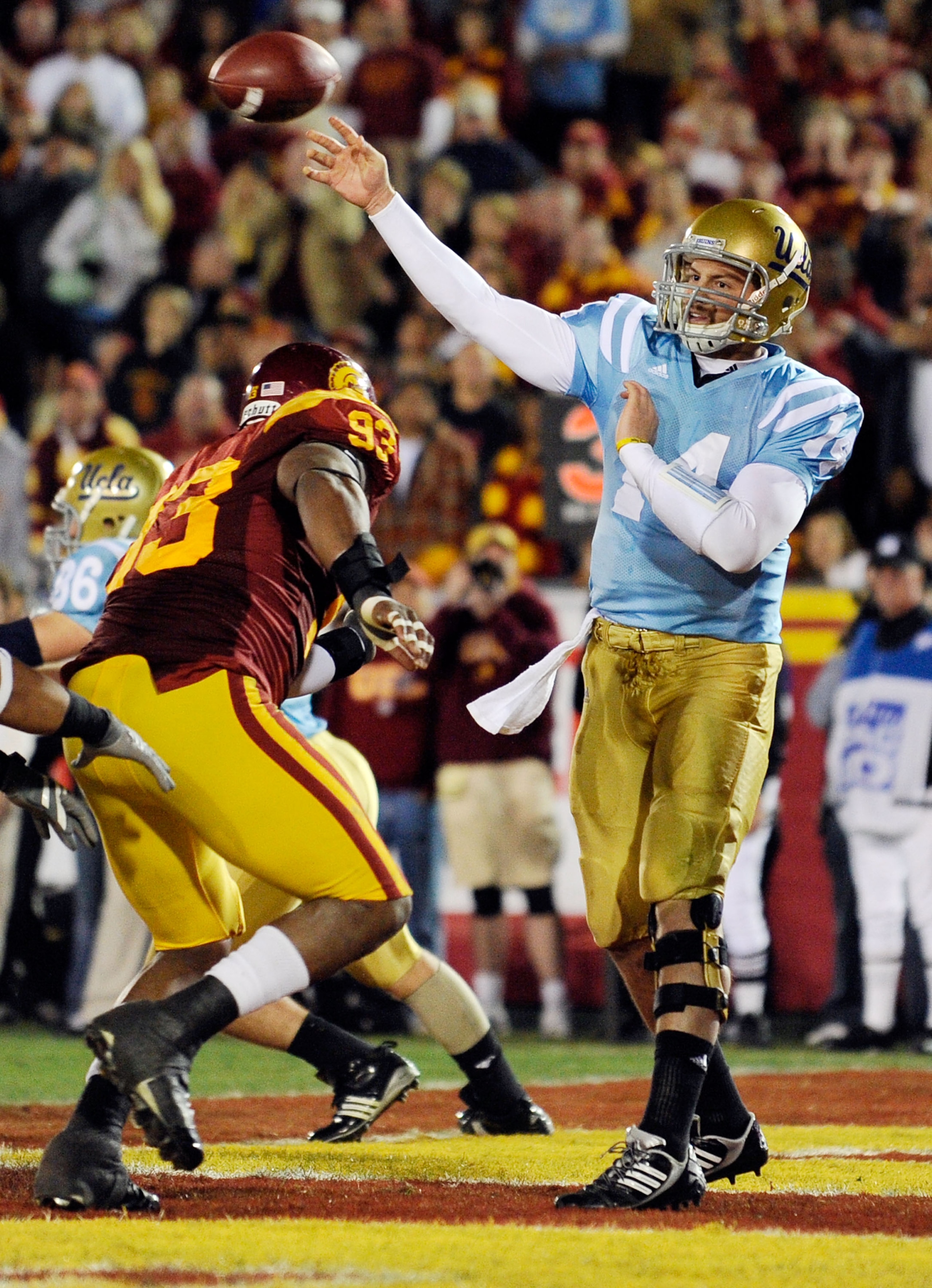 LOS ANGELES, CA - NOVEMBER 28:  Quarterback Kevin Prince #14 of the UCLA Bruins throws a pass from the end zone against USC Trojans during the first quarter of the NCAA college football game at Los Angeles Memorial Coliseum on November 28, 2009 in Los Ang