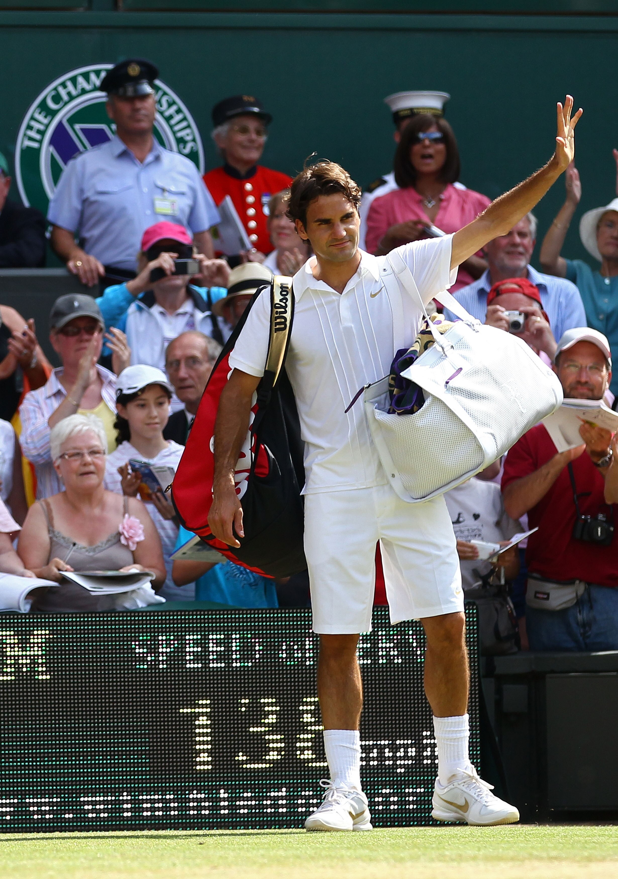 LONDON, ENGLAND - JUNE 30:  Roger Federer of Switzerland waves as he exits after losing his Quarter Final match against Tomas Berdych of Czech Republic on Day Nine of the Wimbledon Lawn Tennis Championships at the All England Lawn Tennis and Croquet Club
