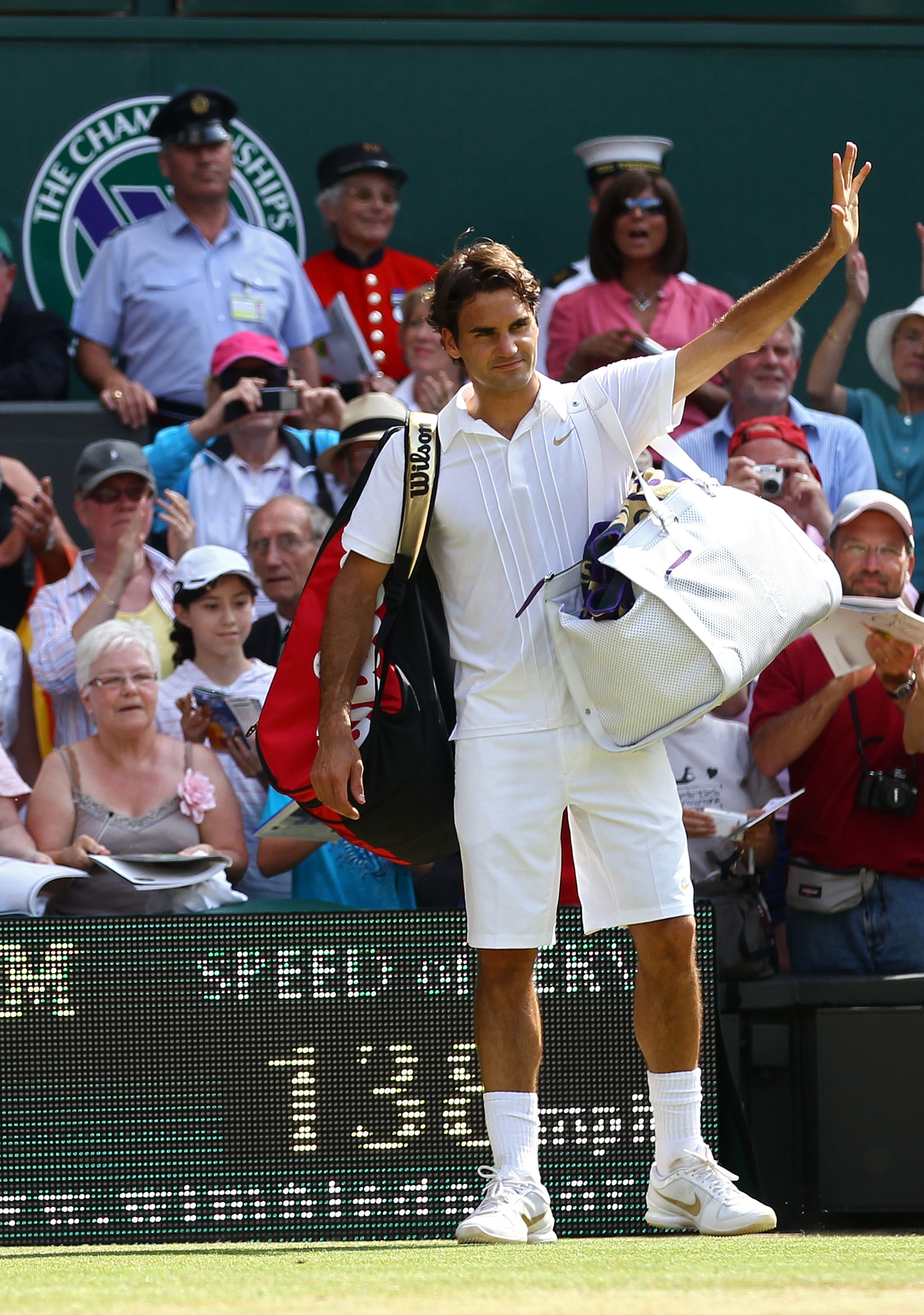 LONDON, ENGLAND - JUNE 30:  Roger Federer of Switzerland waves as he exits after losing his Quarter Final match against Tomas Berdych of Czech Republic on Day Nine of the Wimbledon Lawn Tennis Championships at the All England Lawn Tennis and Croquet Club