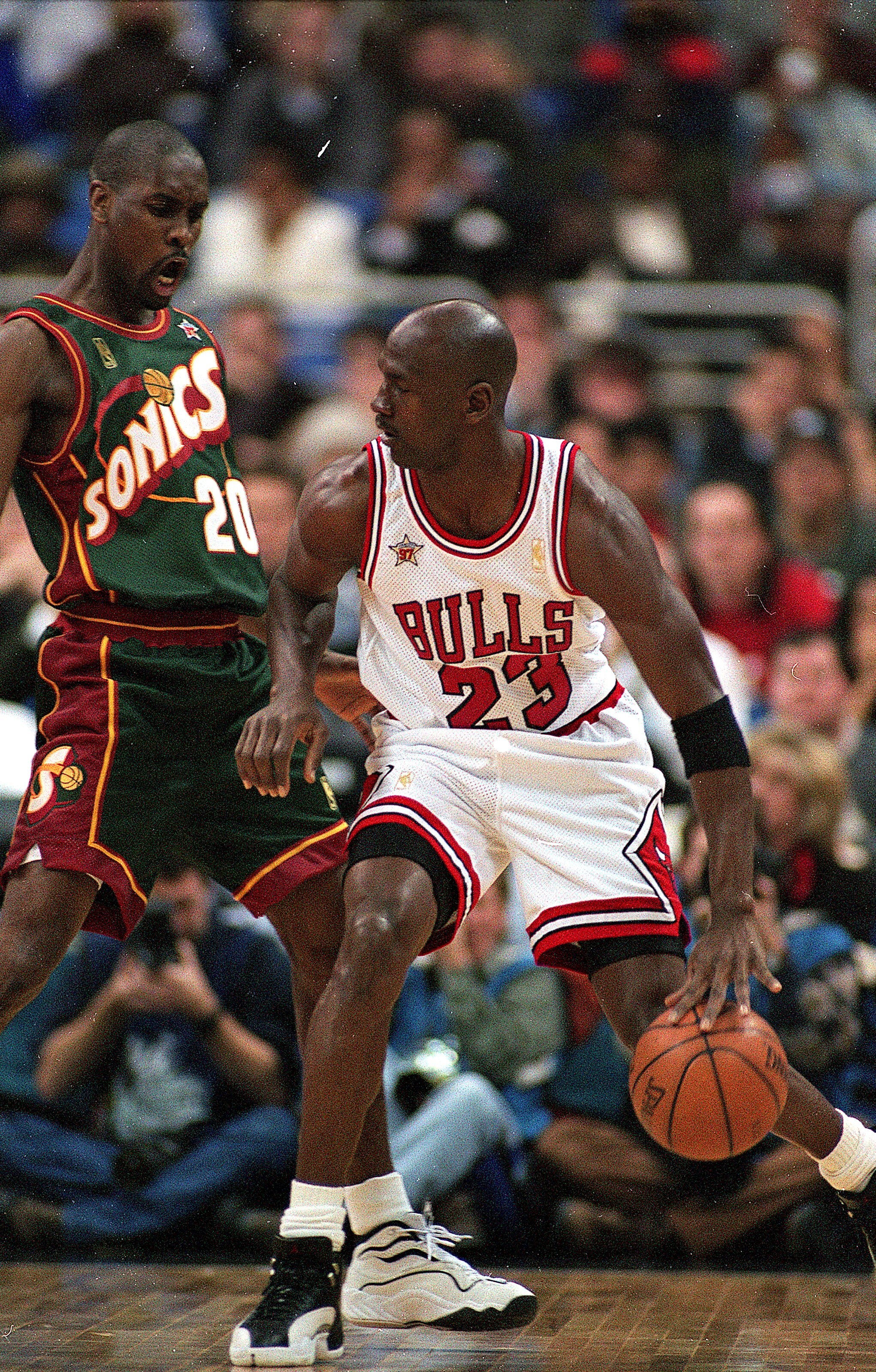 9 Feb 1997: Michael Jordan #23 of the Chicago Bulls dribbles the ball as he is guarded by Gary Payton #20 of Seattle SuperSonics during the NBA All-Star Game at the Gund Arena in Cleveland, Ohio.The East defeated the West 132-120 .