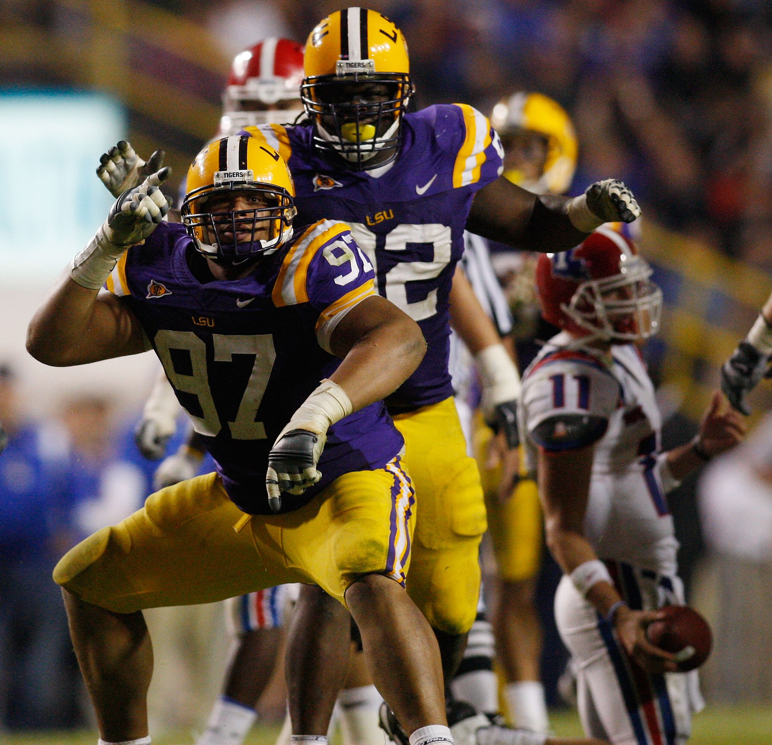 BATON ROUGE, LA - NOVEMBER 14:  Al Woods #97 of the LSU Tigers celebrates after sacking quarterback Ross Jenkins #11 of the Louisiana Tech Bulldogs at Tiger Stadium on November 14, 2009 in Baton Rouge, Louisiana.  The Tigers defeated the Bulldogs 24-16.