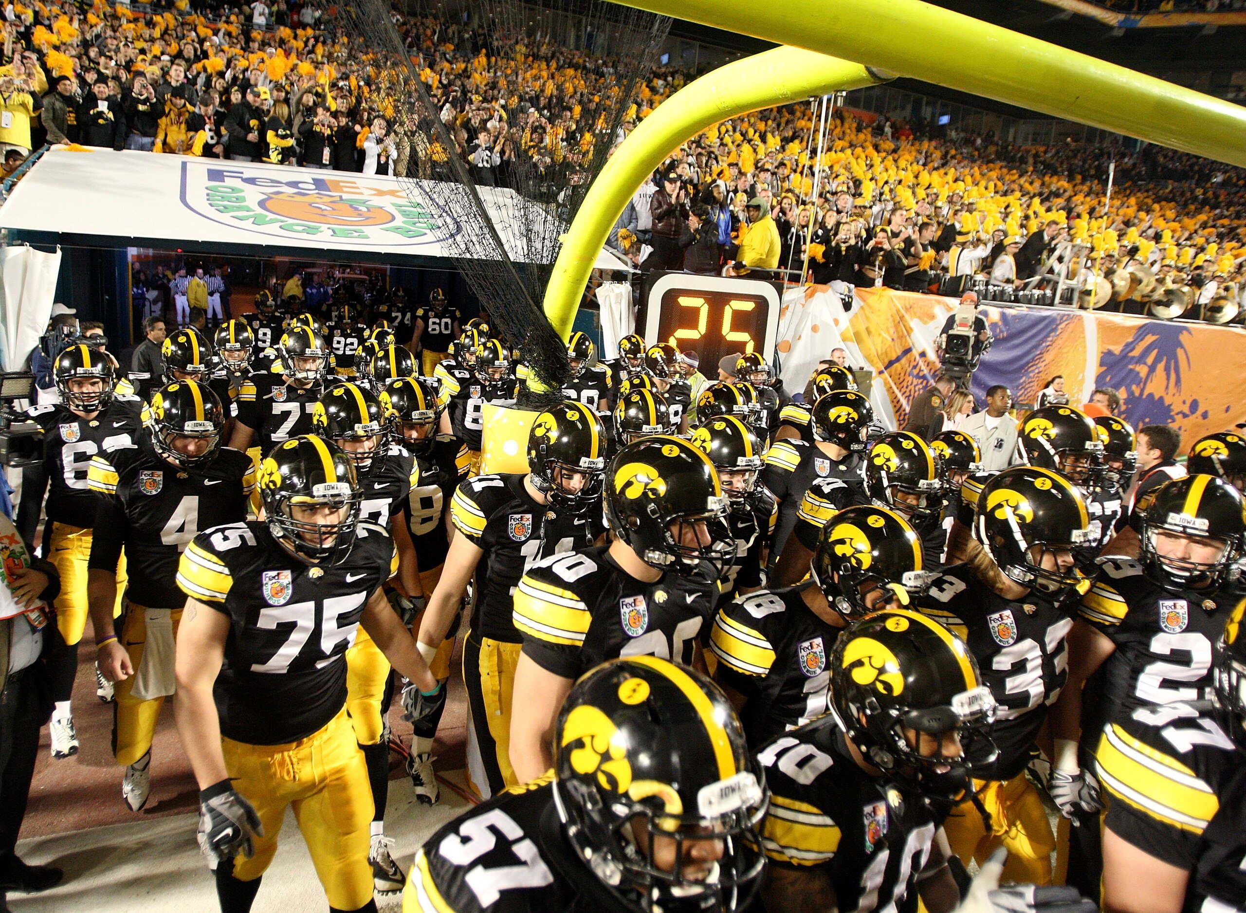 MIAMI GARDENS, FL - JANUARY 05:  The Iowa Hawkeyes take the field in front of their fans against the Georgia Tech Yellow Jackets during the FedEx Orange Bowl at Land Shark Stadium on January 5, 2010 in Miami Gardens, Florida. Iowa won 24-14. (Photo by Str