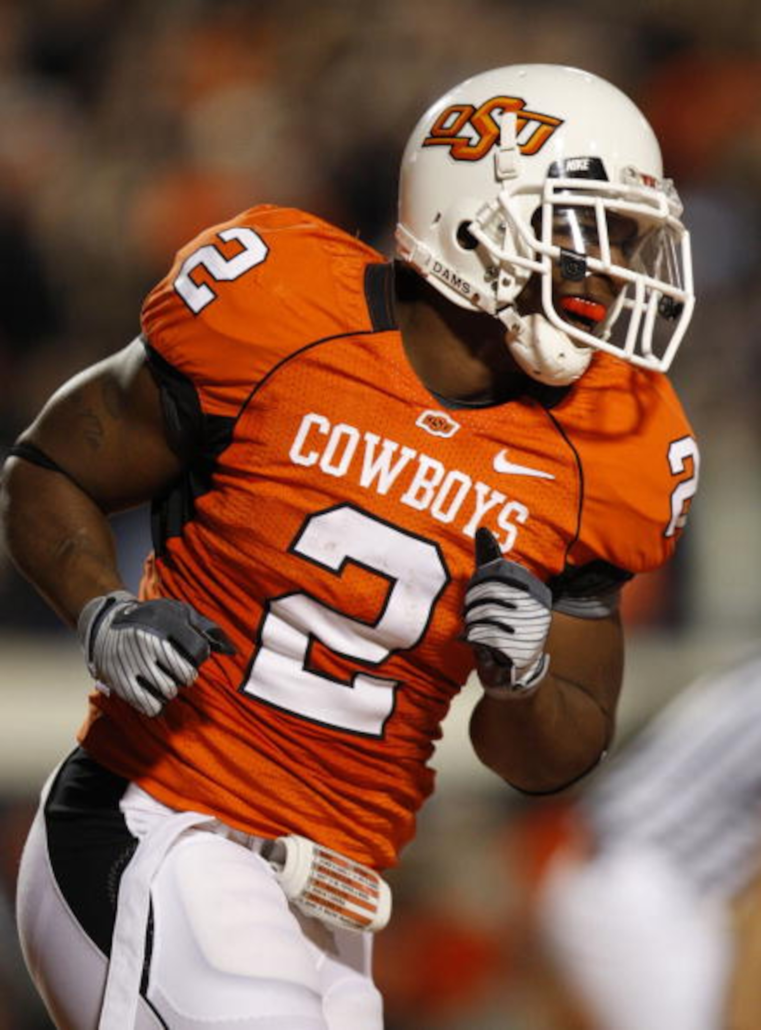 STILLWATER, OK - OCTOBER 31:  Running back Beau Johnson #2 of the Oklahoma State Cowboys celebrates his touchdown in the second quarter of the game against the Texas Longhorns at Boone Pickens Stadium on October 31, 2009 in Stillwater, Oklahoma.  (Photo b