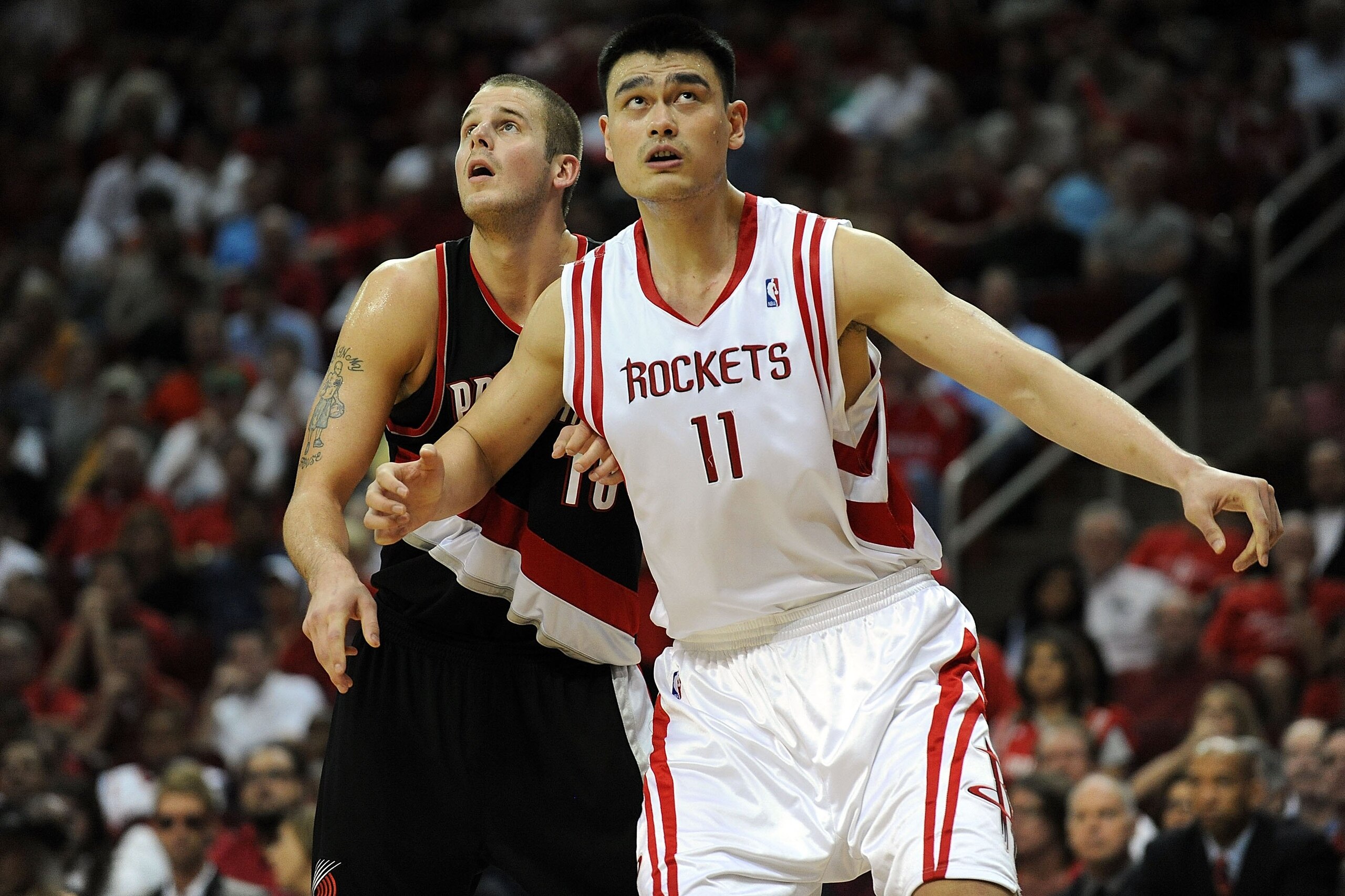 HOUSTON - APRIL 26:  Center Joel Przybilla #10 of the Portland Trail Blazers and Yao Ming #11 of the Houston Rockets in Game Four of the Western Conference Quarterfinals during the 2009 NBA Playoffs at Toyota Center on April 26, 2009 in Houston, Texas. NO