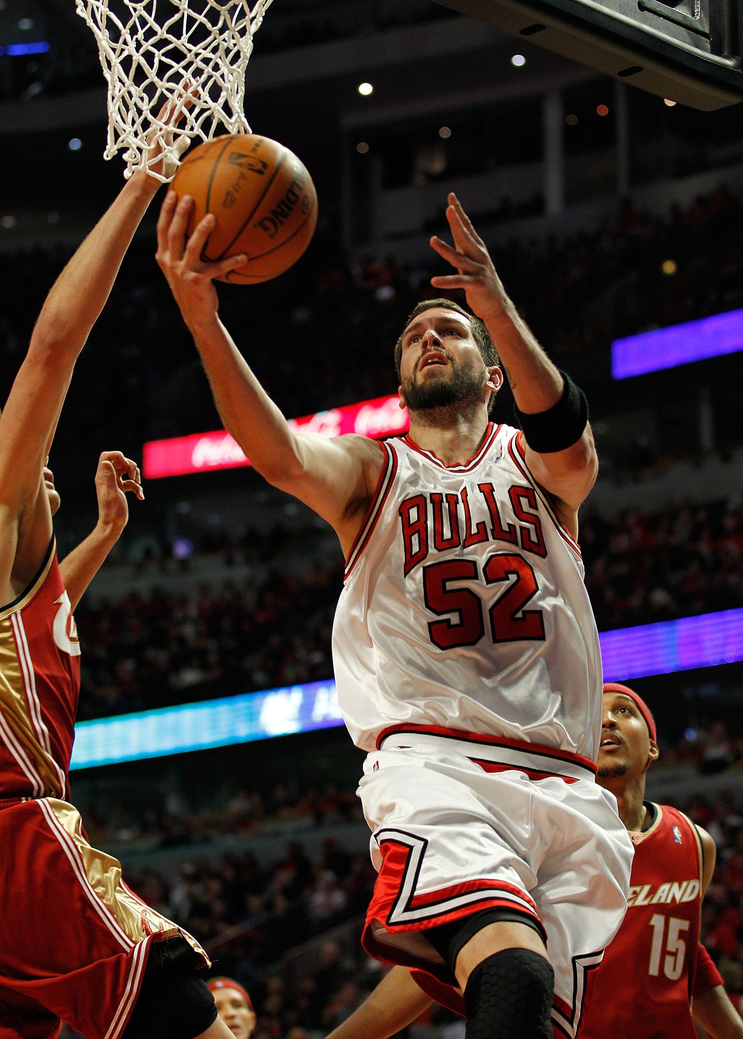 CHICAGO - APRIL 25: Brad Miller #52 of the Chicago Bulls puts up a shot against the Cleveland Cavaliers in Game Four of the Eastern Conference Quarterfinals during the 2010 NBA Playoffs at the United Center on April 25, 2010 in Chicago, Illinois. The Cava