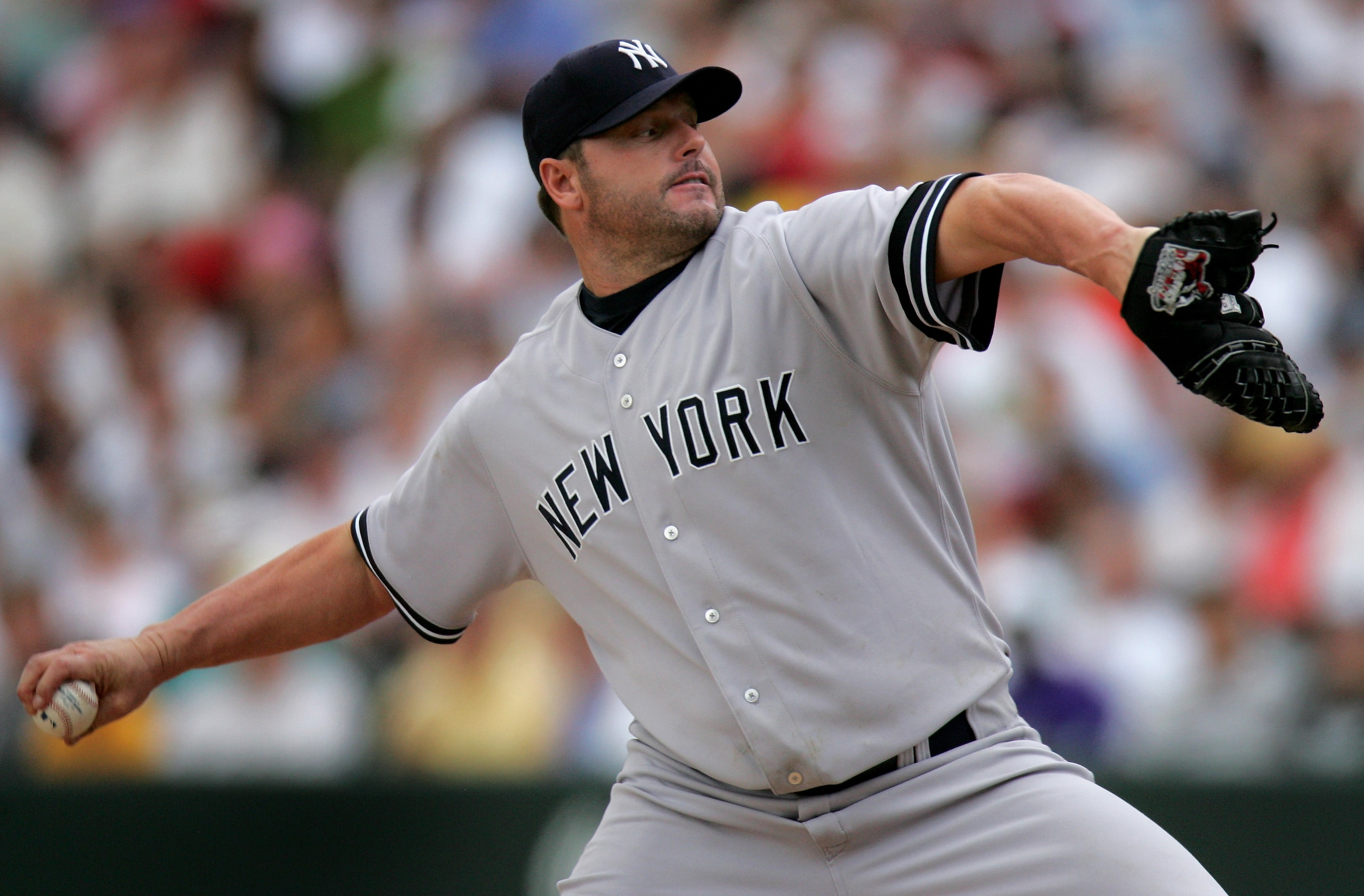 DENVER - JUNE 21:  Starting pitcher Roger Clemens #22 of the New York Yankees delivers against the Colorado Rockies and collected the loss as the Rockies defeated the Yankees 4-3 during interleague play at Coors Field on June 21, 2007 in Denver, Colorado.