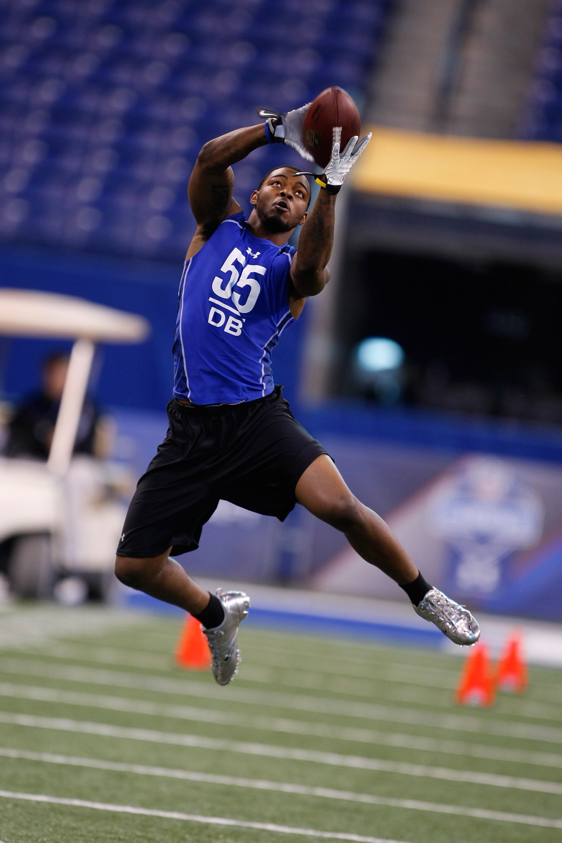 INDIANAPOLIS, IN - MARCH 2: Defensive back Donovan Warren of Michigan jumps in the air to catch the football in drills during the NFL Scouting Combine presented by Under Armour at Lucas Oil Stadium on March 2, 2010 in Indianapolis, Indiana. (Photo by Scot