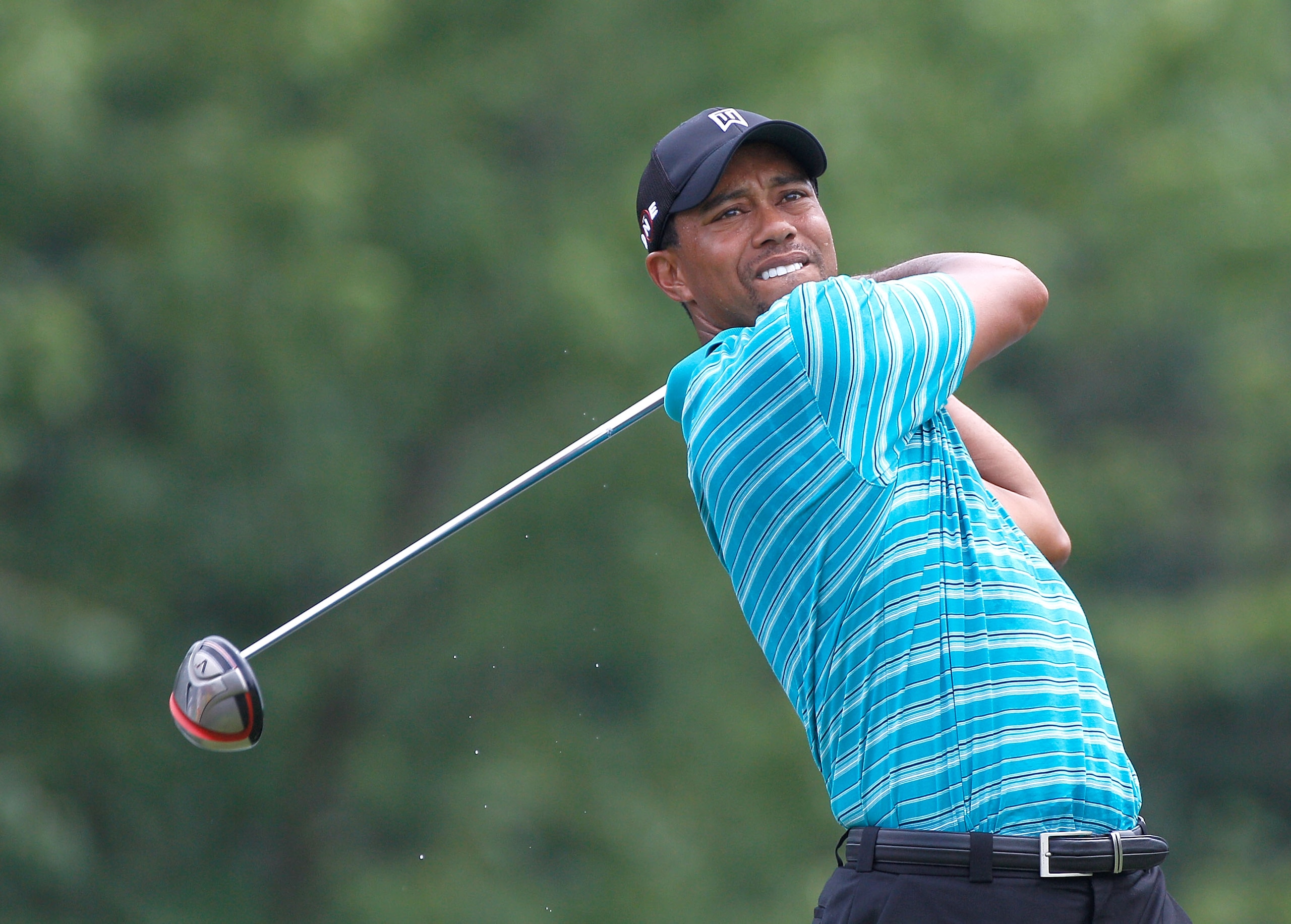 AKRON, OH - AUGUST 04: Tiger Woods plays a shot during a practice round prior to the WGC- Bridgestone Invitational on the South Course at Firestone Country Club on August 4, 2010 in Akron, Ohio. (Photo by Sam Greenwood/Getty Images) AKRON, OH - AUGUST 04: Tiger Woods plays a shot during a practice round prior to the WGC- Bridgestone Invitational on the South Course at Firestone Country Club on August 4, 2010 in Akron, Ohio. (Photo by Sam Greenwood/Getty Images)