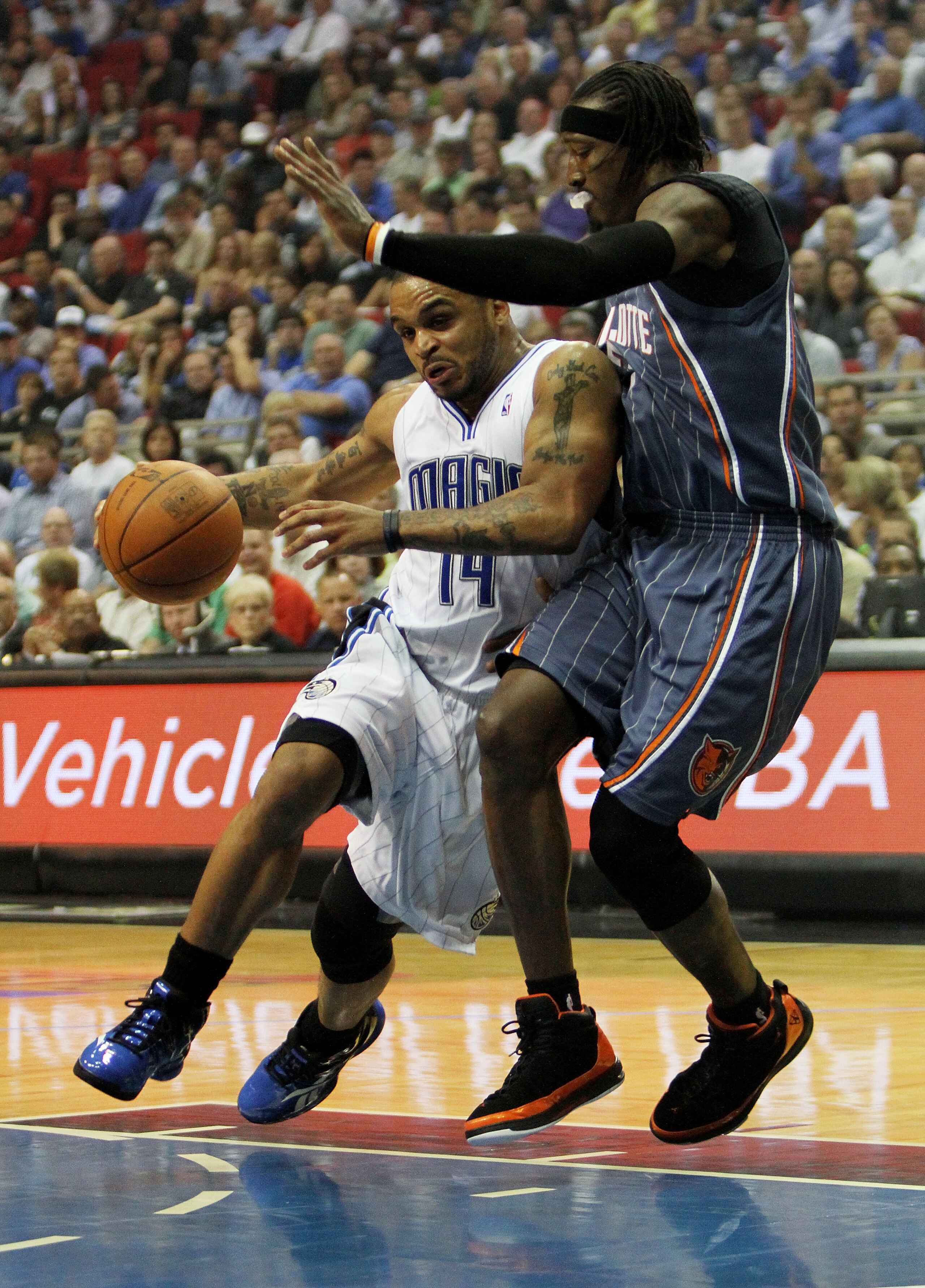 ORLANDO, FL - APRIL 21: Jameer Nelson #14 of the Orlando Magic drives around Gerald Wallace #3 of the Charlotte Bobcats in Game Two of the Eastern Conference Quarterfinals during the 2010 NBA Playoffs at Amway Arena on April 21, 2010 in Orlando, Florida. ORLANDO, FL - APRIL 21: Jameer Nelson #14 of the Orlando Magic drives around Gerald Wallace #3 of the Charlotte Bobcats in Game Two of the Eastern Conference Quarterfinals during the 2010 NBA Playoffs at Amway Arena on April 21, 2010 in Orlando, Florida.