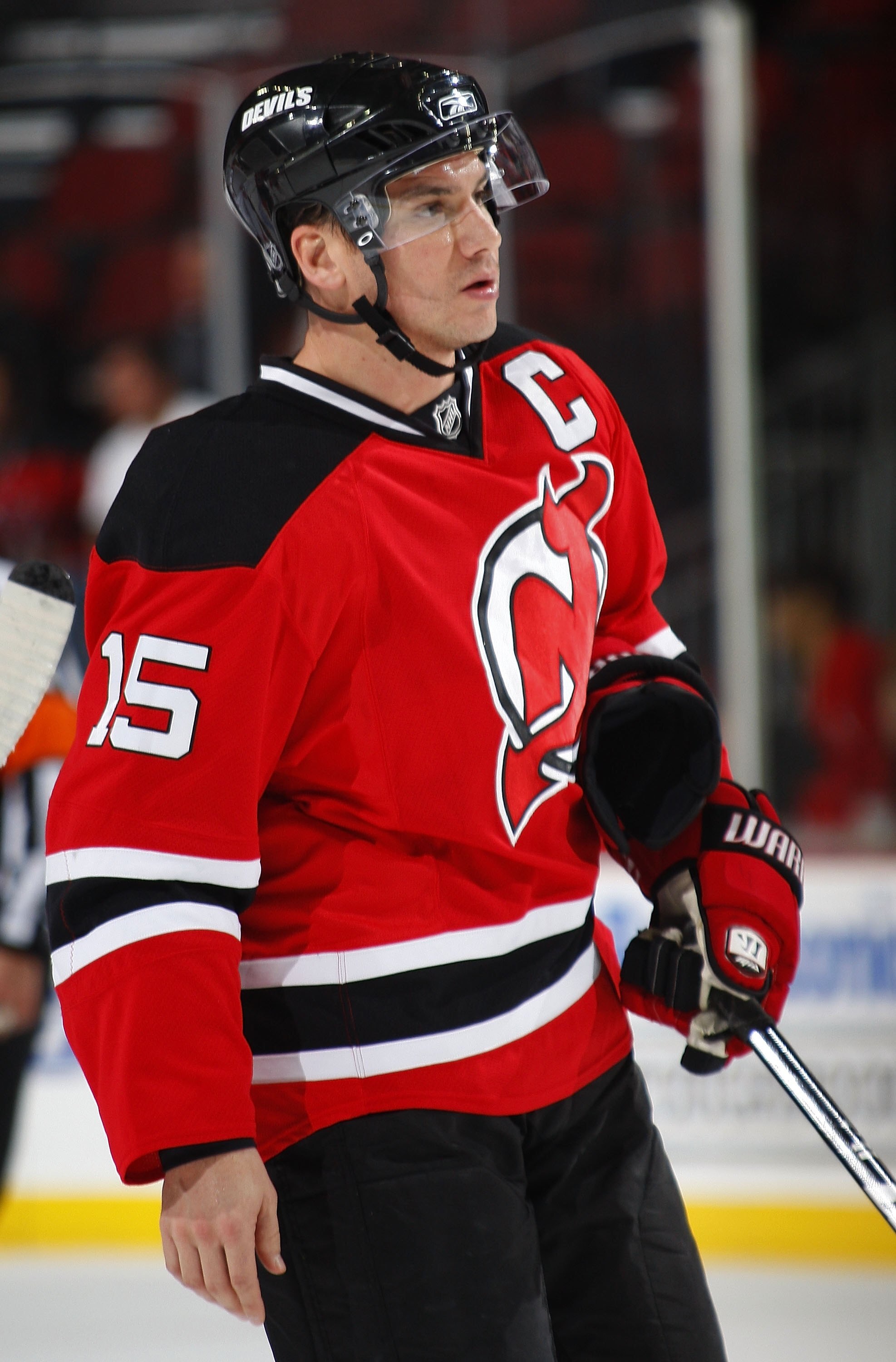 NEWARK, NJ - DECEMBER 09:  Jamie Langenbrunner #15 of the New Jersey Devils skates to take a faceoff against the Carolina Hurricanes on December 9, 2009 in Newark, New Jersey.  (Photo by Paul Bereswill/Getty Images)