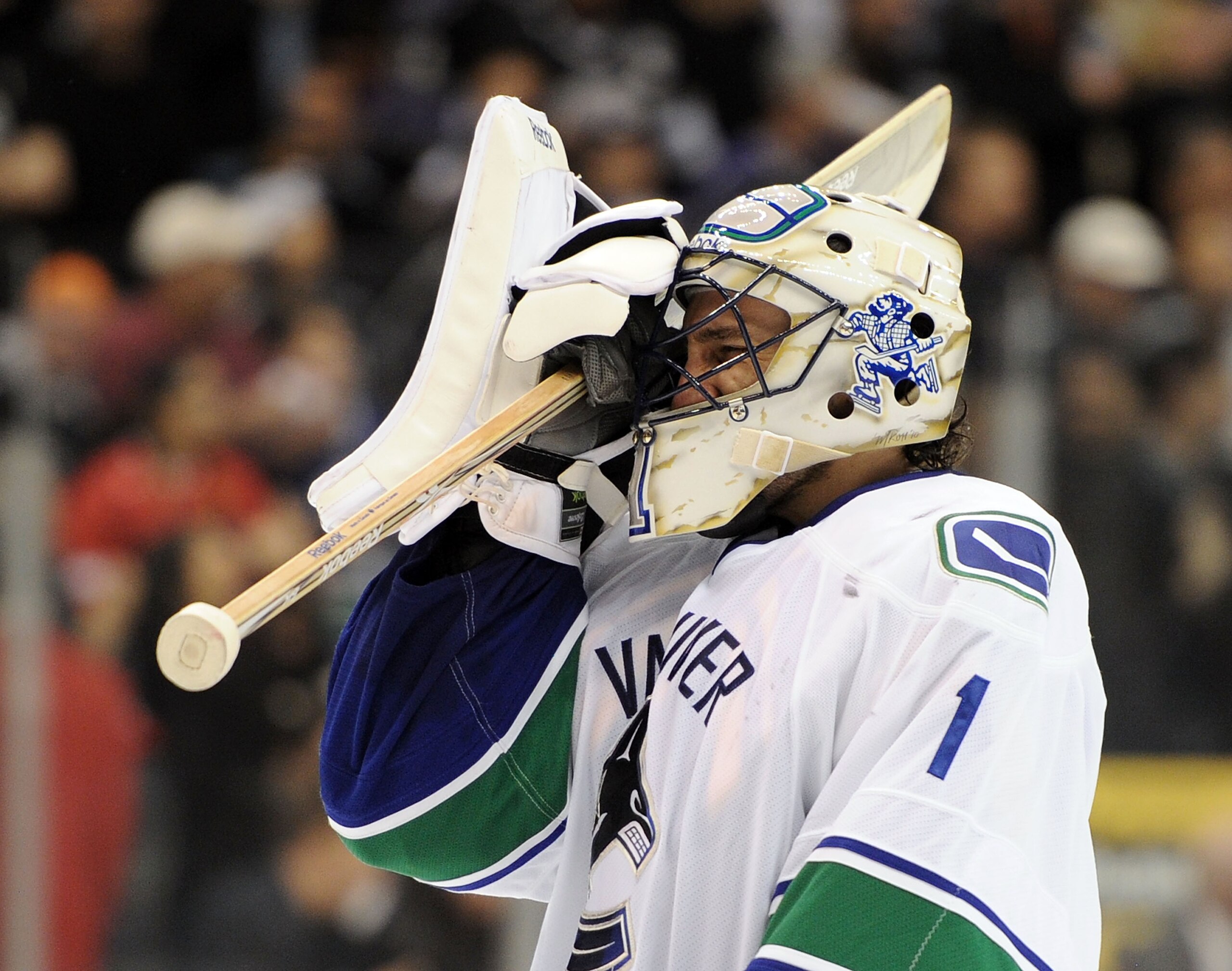 LOS ANGELES, CA - APRIL 21:  Roberto Luongo #1 of the Vancouver Canucks adjust his mask in the game against the Los Angeles Kings during the second period in game four of the Western Conference Quarter-final at Staples Center on April 21, 2010 in Los Ange