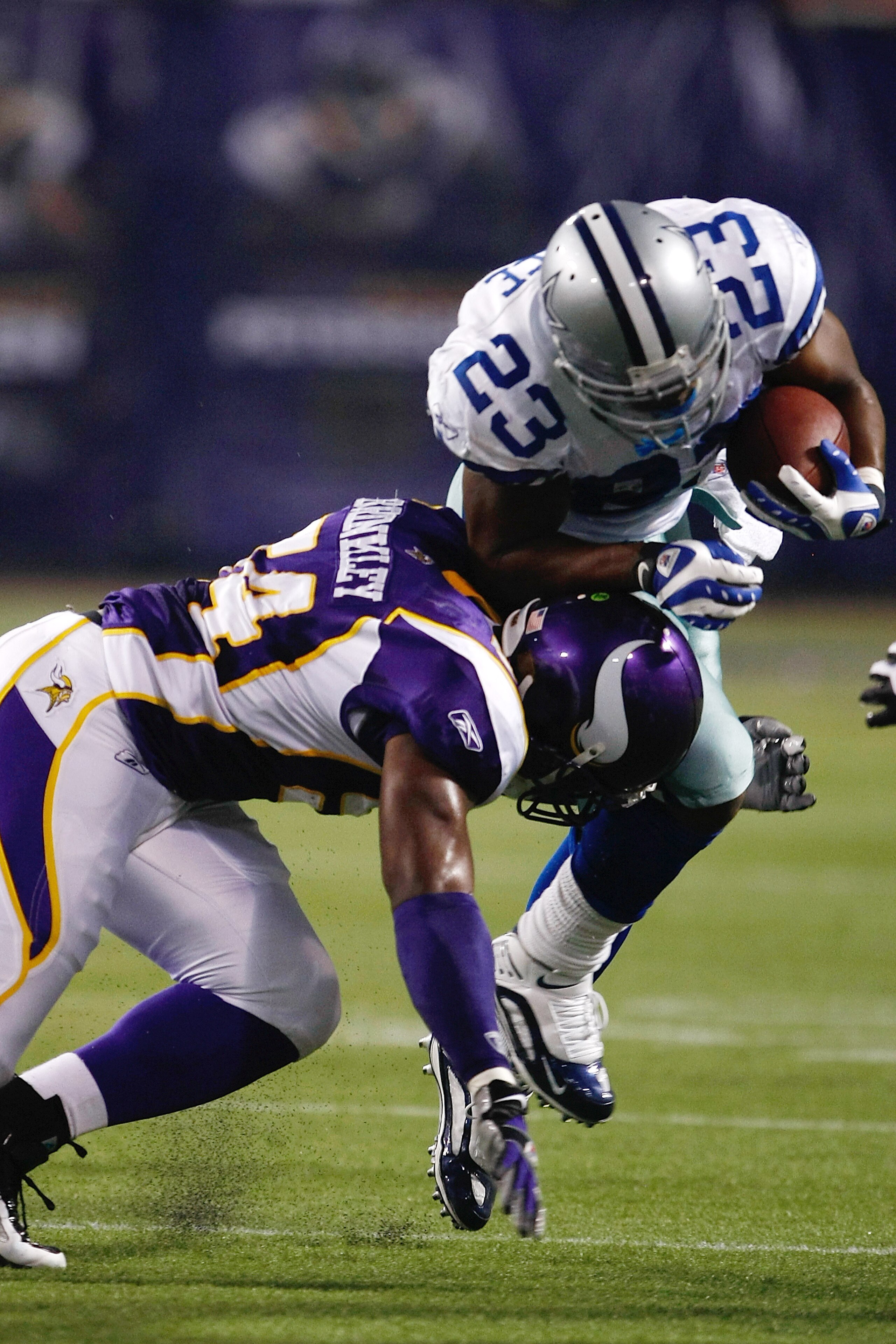 MINNEAPOLIS, MN - SEPTEMBER 4: Running back Tashard Choice #23 of the Dallas Cowboys runs with the football as he is hit by linebacker Jasper Brinkley #54 of the Minnesota Vikings at Hubert H. Humphrey Metrodome on September 4, 2009 in Minneapolis, Minnes