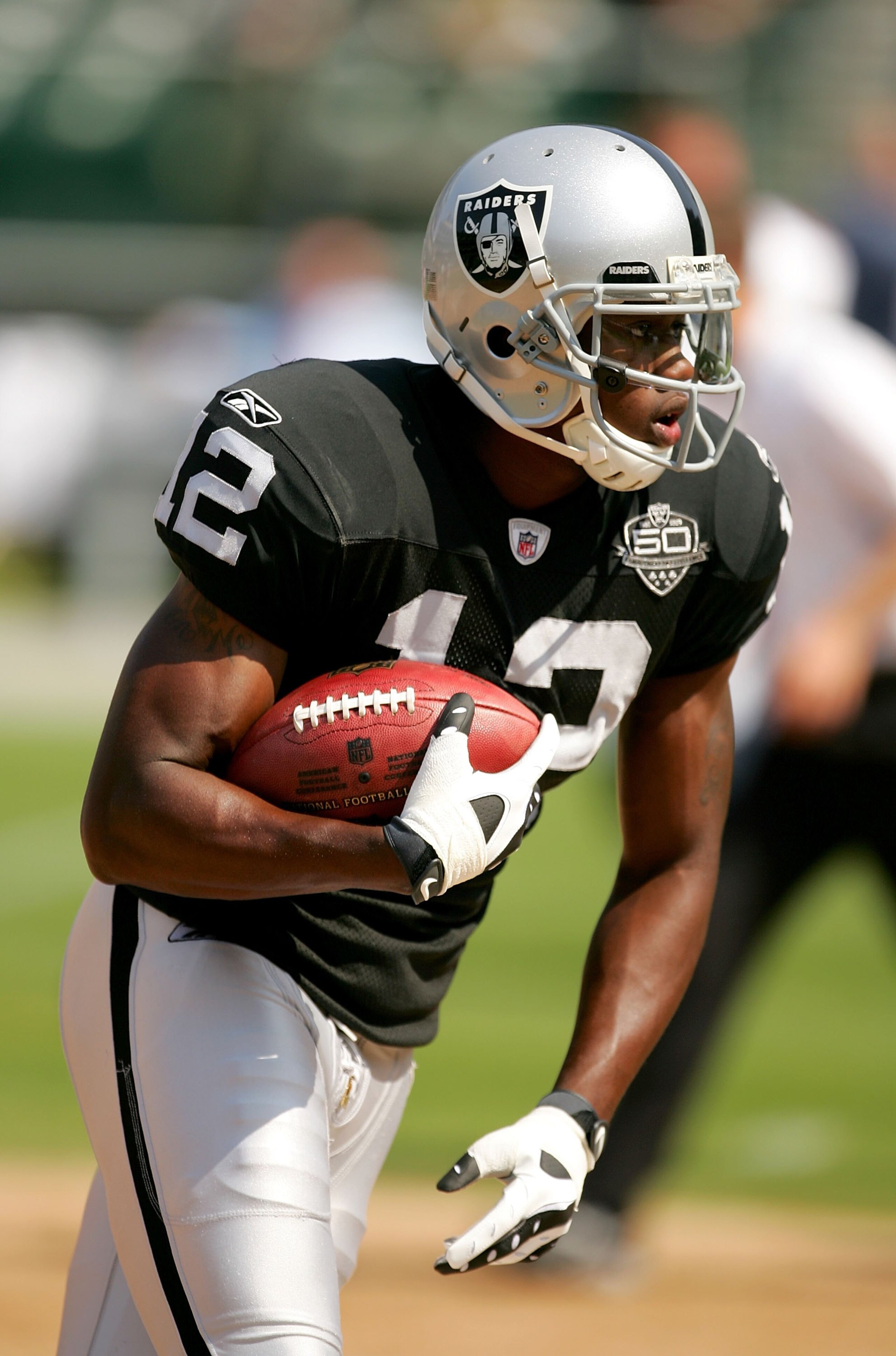 OAKLAND, CA - SEPTEMBER 27:  Darrius Heyward-Bey #12 of the Oakland Raiders warms up before their game against the Denver Broncos at the Oakland-Alameda County Coliseum on September 27, 2009 in Oakland, California.  (Photo by Ezra Shaw/Getty Images)