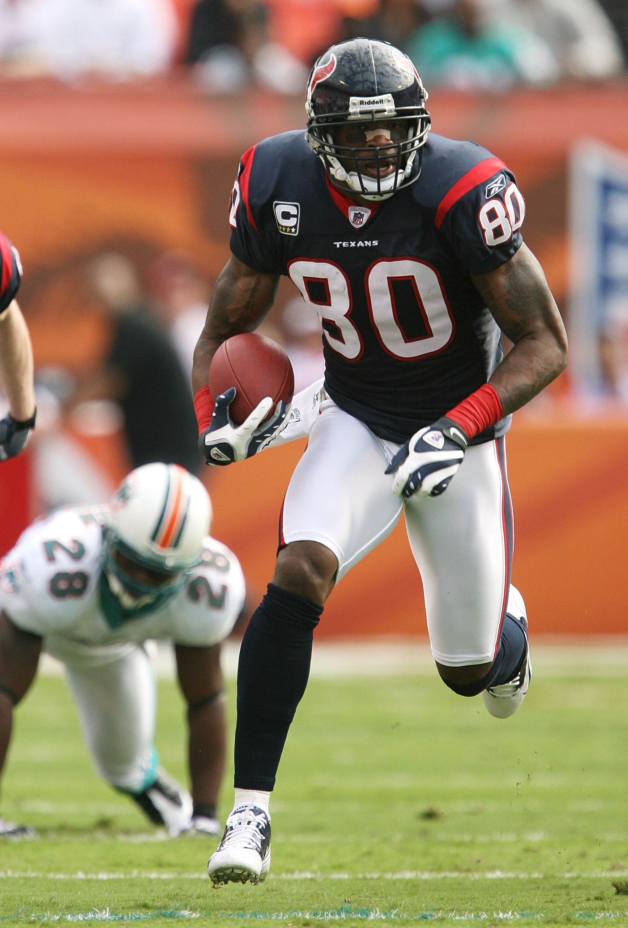 MIAMI - DECEMBER 27:  Wide receiver Andre Johnson #80 of the Houston Texans breaks away for a long play while taking on the Miami Dolphins for a touchdown at Land Shark Stadium on December 27, 2009 in Miami, Florida.  (Photo by Doug Benc/Getty Images)