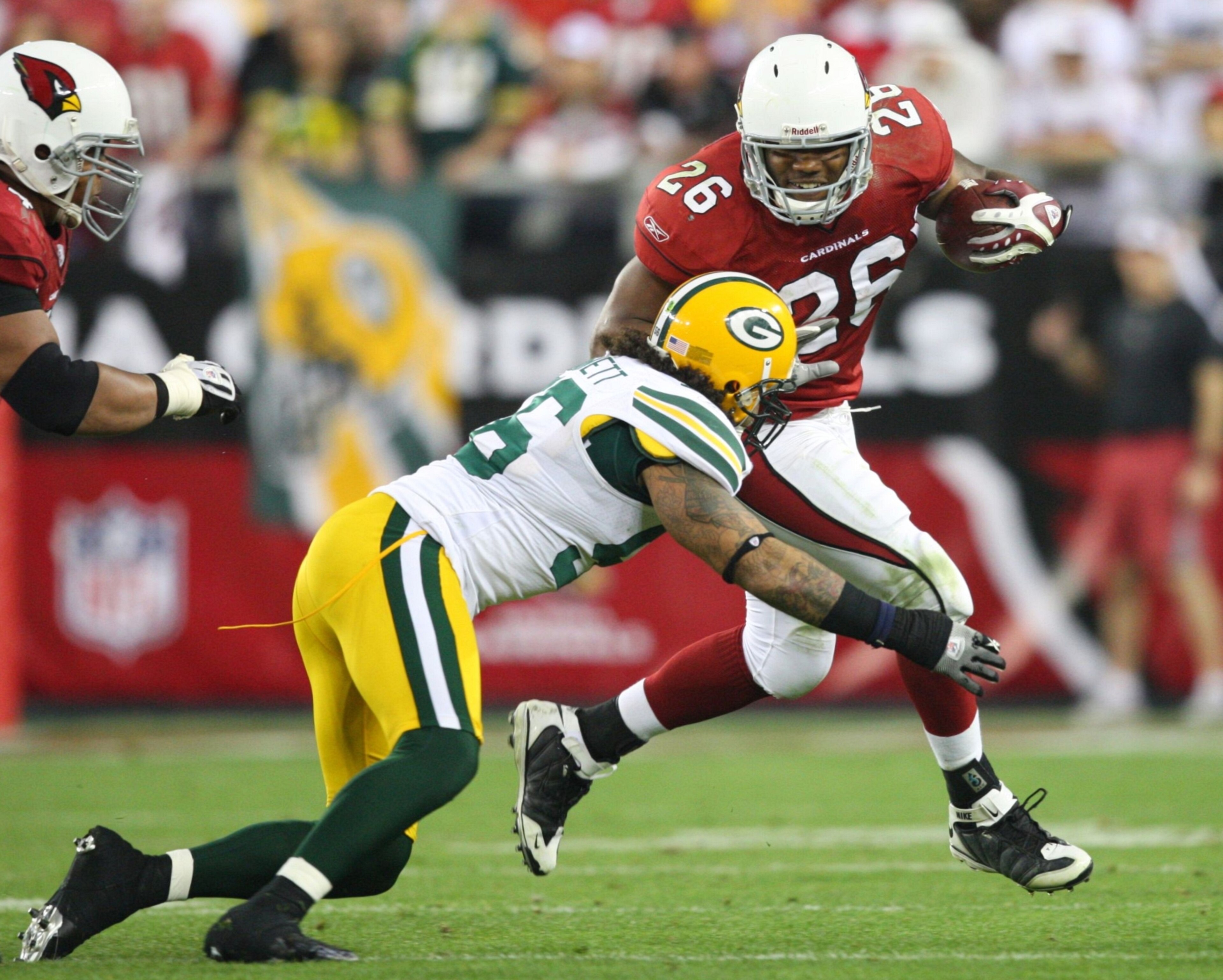 GLENDALE, AZ - JANUARY 10:  Beanie Wells #26 of the Arizona Cardinals carries the ball during the fourth quarter of the 2010 NFC wild-card playoff game against the Green Bay Packers at University of Phoenix Stadium on January 10, 2010 in Glendale, Arizona