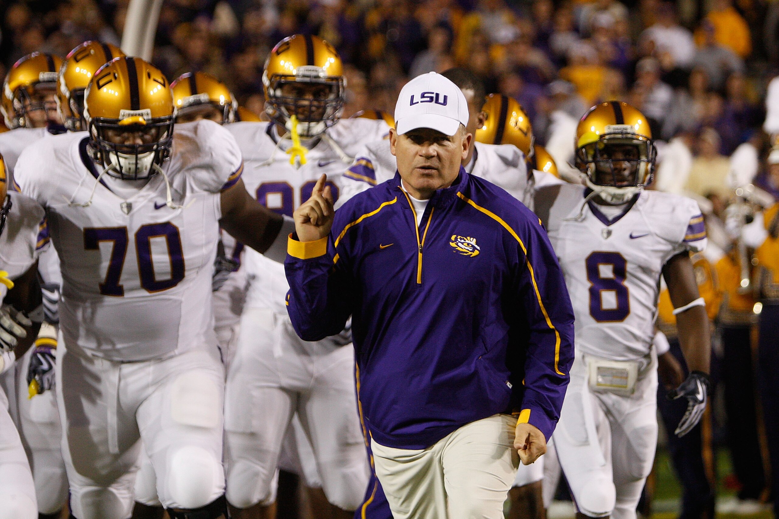 BATON ROUGE, LA - NOVEMBER 28: Head coach Les Miles of the LSU Tigers takes the field before the game against the Arkansa Razorbacks at Tiger Stadium on November 28, 2009 in Baton Rouge, Louisiana. The Tigers defeated the Razorbacks 33-30 in overtime. BATON ROUGE, LA - NOVEMBER 28: Head coach Les Miles of the LSU Tigers takes the field before the game against the Arkansa Razorbacks at Tiger Stadium on November 28, 2009 in Baton Rouge, Louisiana. The Tigers defeated the Razorbacks 33-30 in overtime.
