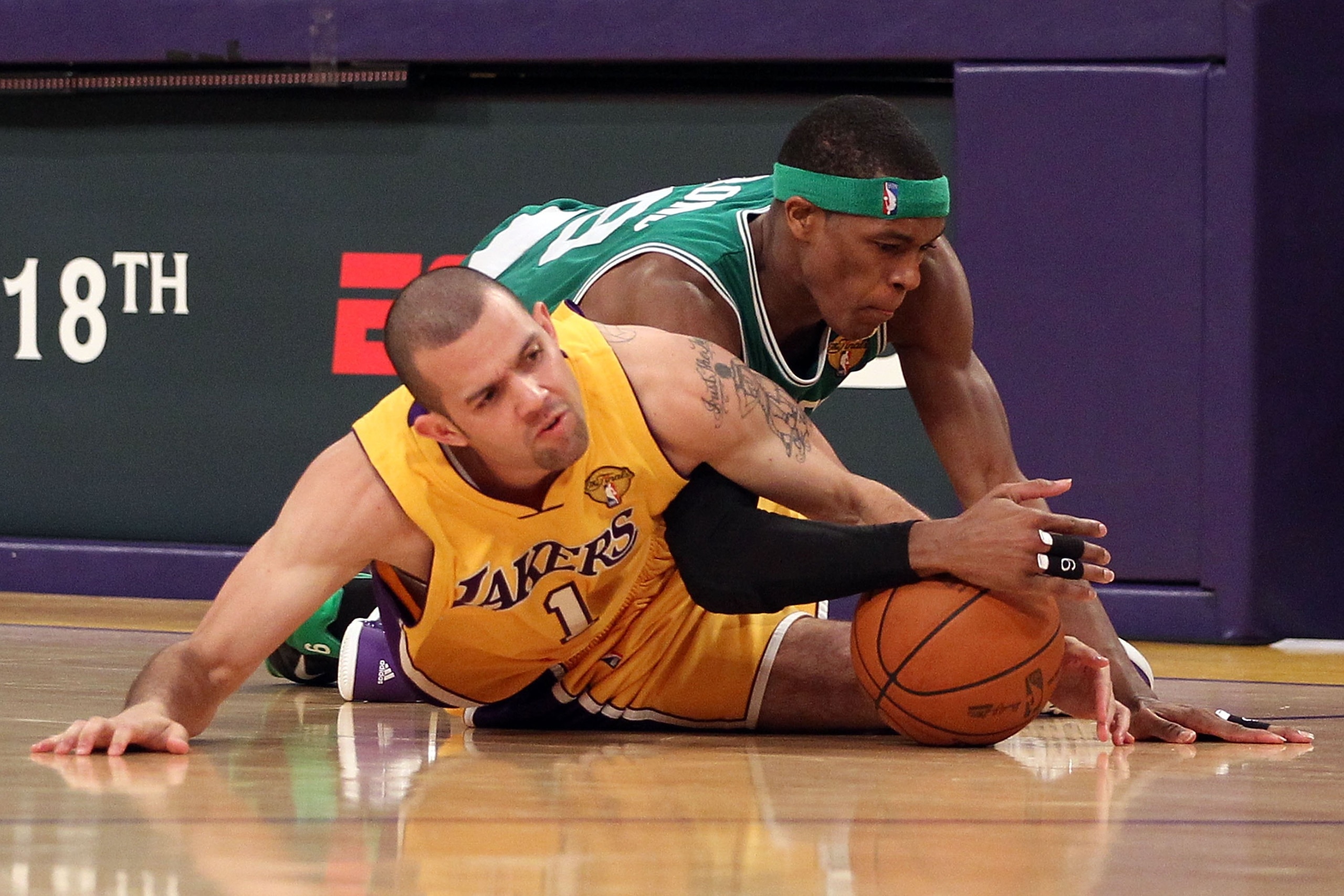 LOS ANGELES, CA - JUNE 15: Jordan Farmar #1 of the Los Angeles Lakers and Rajon Rondo #9 of the Boston Celtics battle for a loose ball in the second half of Game Six of the 2010 NBA Finals at Staples Center on June 15, 2010 in Los Angeles, California. N LOS ANGELES, CA - JUNE 15: Jordan Farmar #1 of the Los Angeles Lakers and Rajon Rondo #9 of the Boston Celtics battle for a loose ball in the second half of Game Six of the 2010 NBA Finals at Staples Center on June 15, 2010 in Los Angeles, California. N