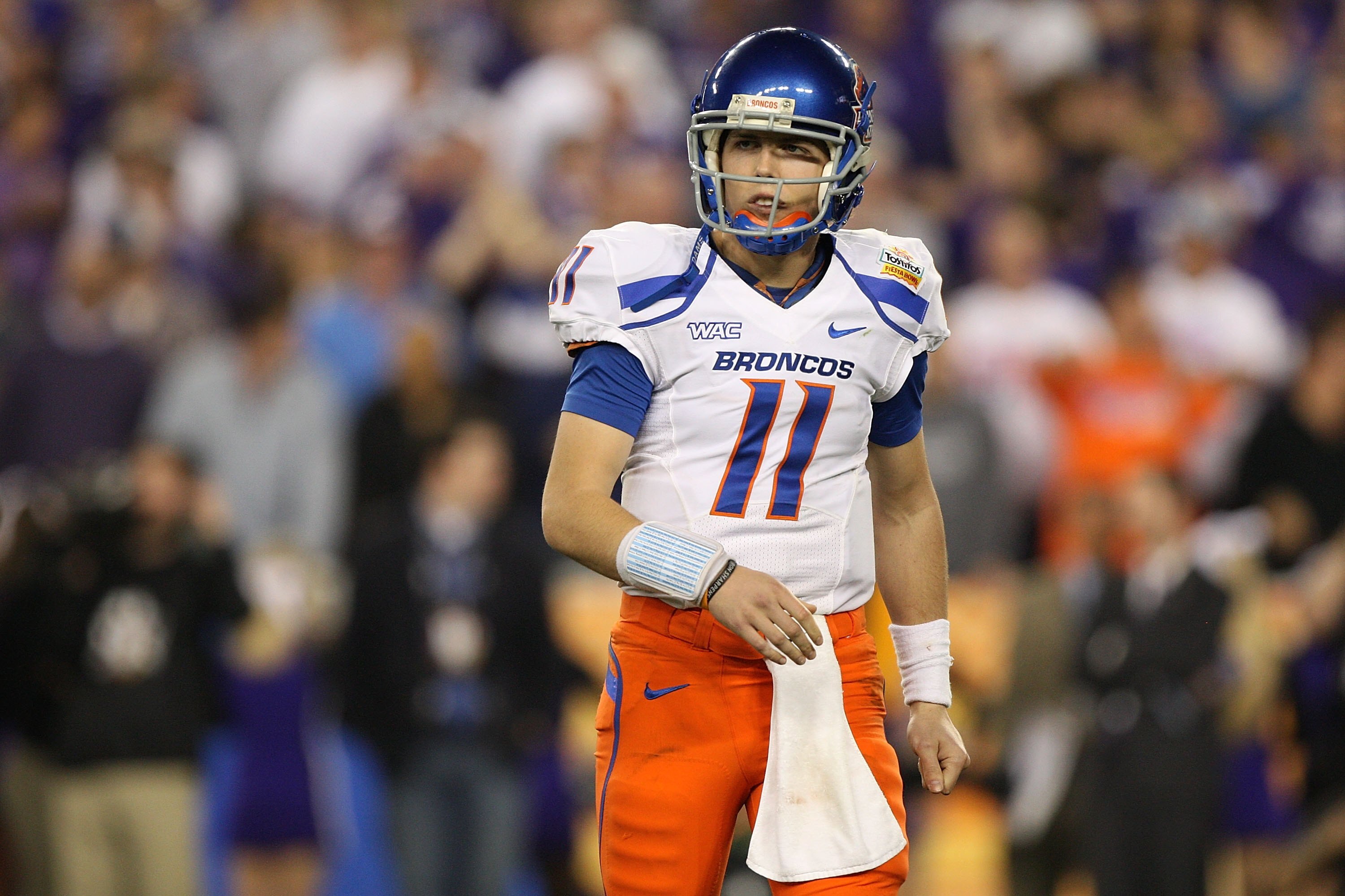 GLENDALE, AZ - JANUARY 04:  Quarterback Kellen Moore #11 of the Boise State Broncos looks over to his sideline in the second half against the TCU Horned Frogs during the Tostitos Fiesta Bowl at the Universtity of Phoenix Stadium on January 4, 2010 in Glen