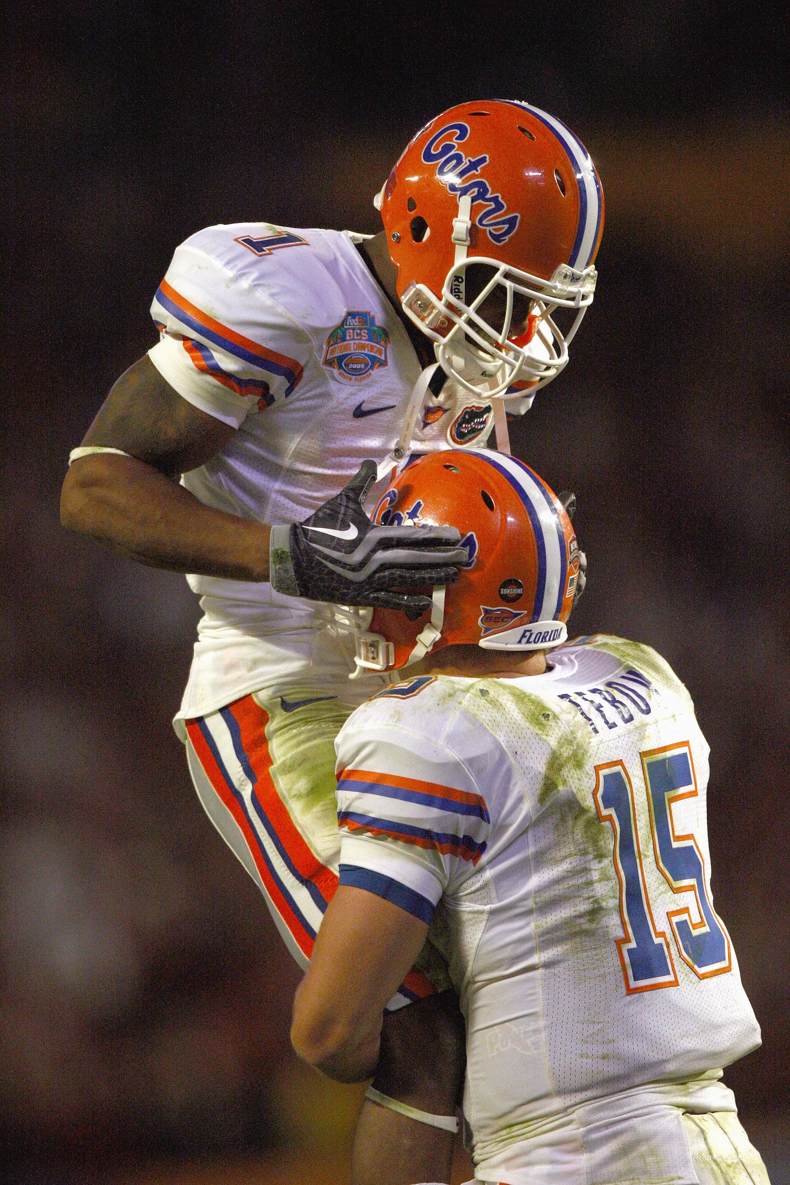 MIAMI - JANUARY 08:  Percy Harvin #1 of the Florida Gators celebrates with quarterback Tim Tebow #15 during the FedEx BCS National Championship Game against the Oklahoma Sooners at Dolphin Stadium on January 8, 2009 in Miami, Florida.  (Photo by Donald Mi