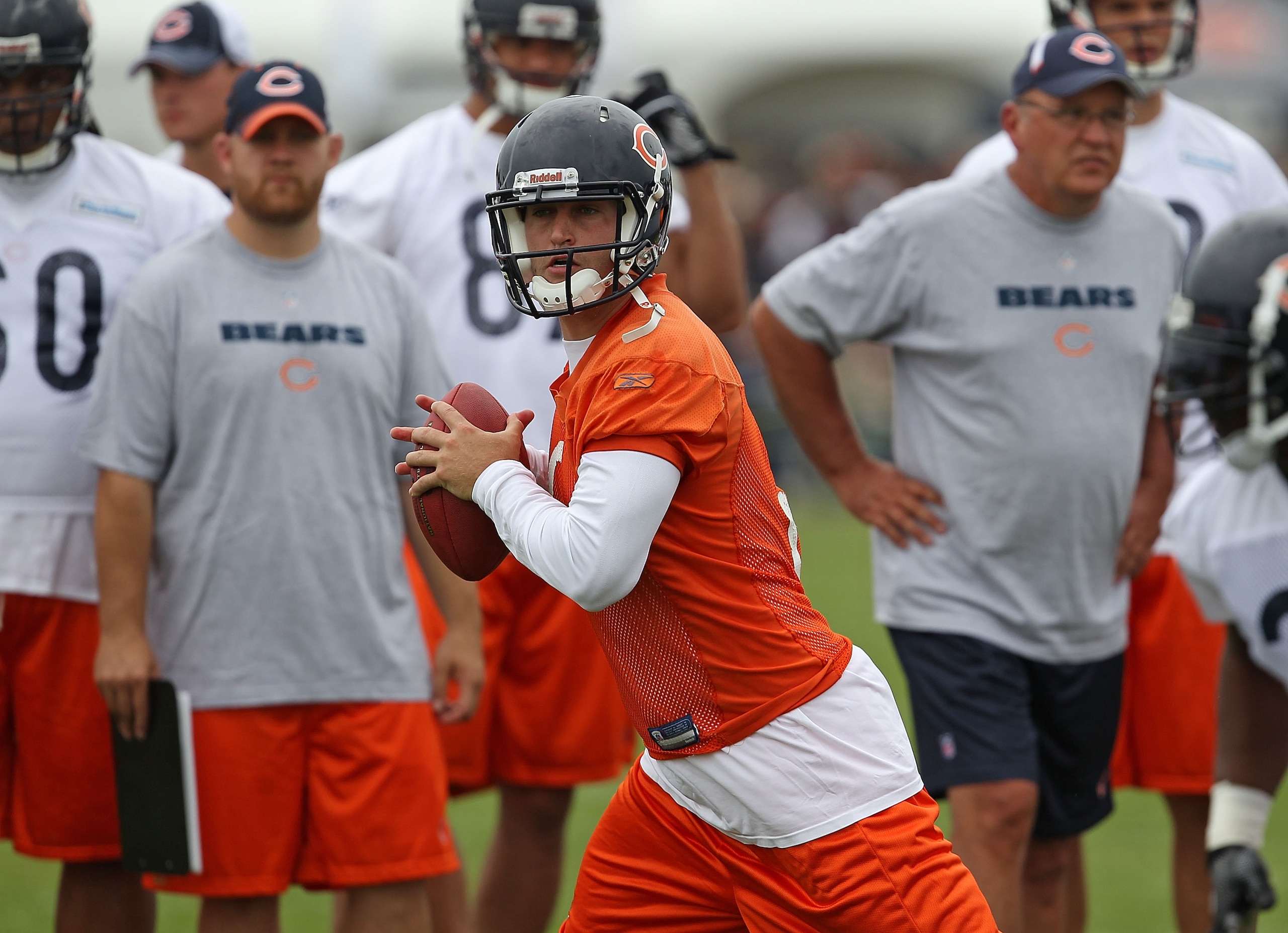 BOURBONNAIS, IL - JULY 30: Jay Culter #6 of the Chicago Bears looks for a receiver as teammates and coaches watch during a summer training camp practice at Olivet Nazarene University on July 30, 2010 in Bourbonnais, Illinois. (Photo by Jonathan Daniel/Get