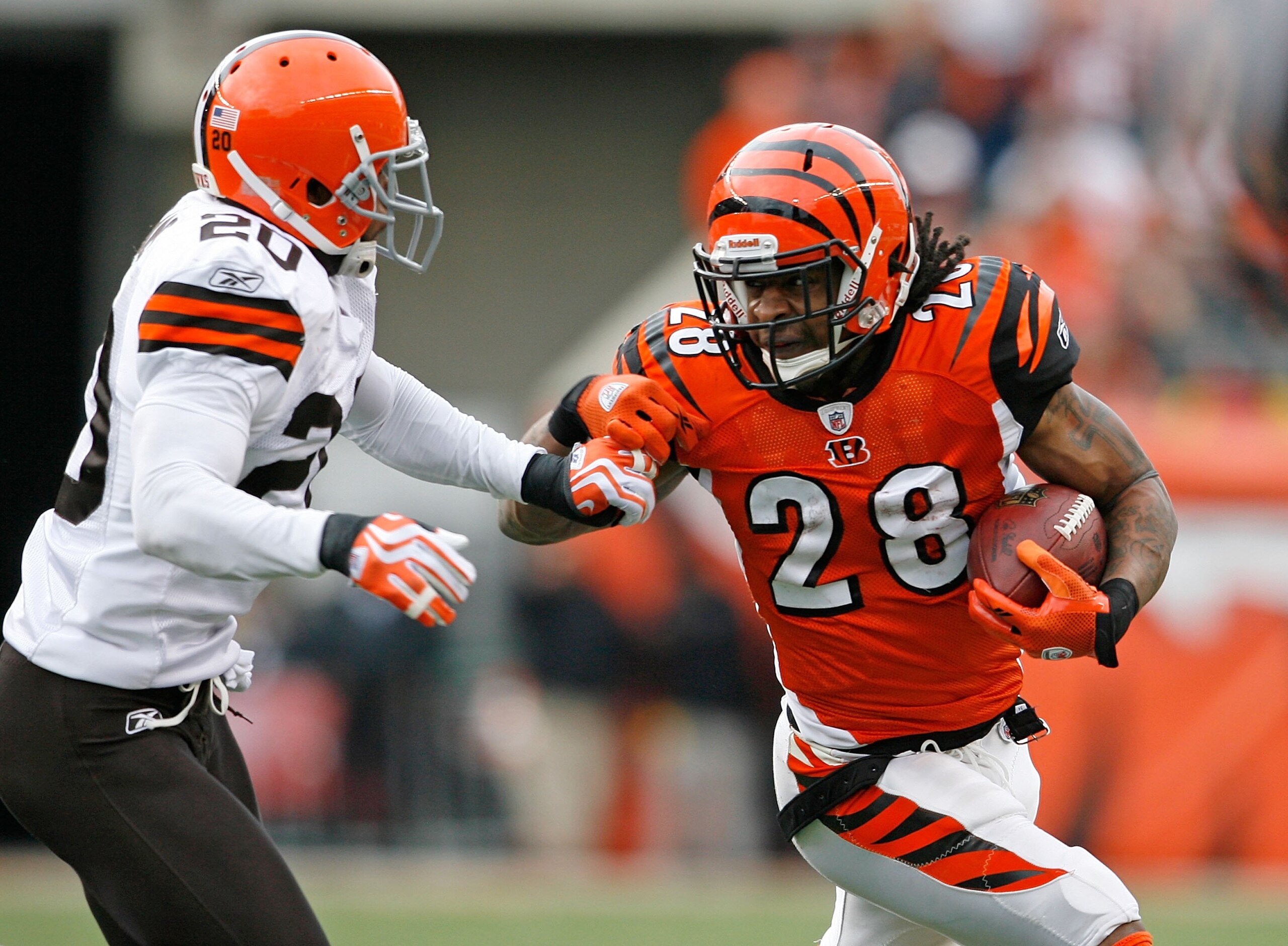 CINCINNATI - NOVEMBER 29:  Bernard Scott #28 of the Cincinnati Bengals runs with the ball  while defended by Mike Adams #20 of the Cleveland Browns at Paul Brown Stadium on November 29, 2009 in Cincinnati, Ohio.  (Photo by Andy Lyons/Getty Images)
