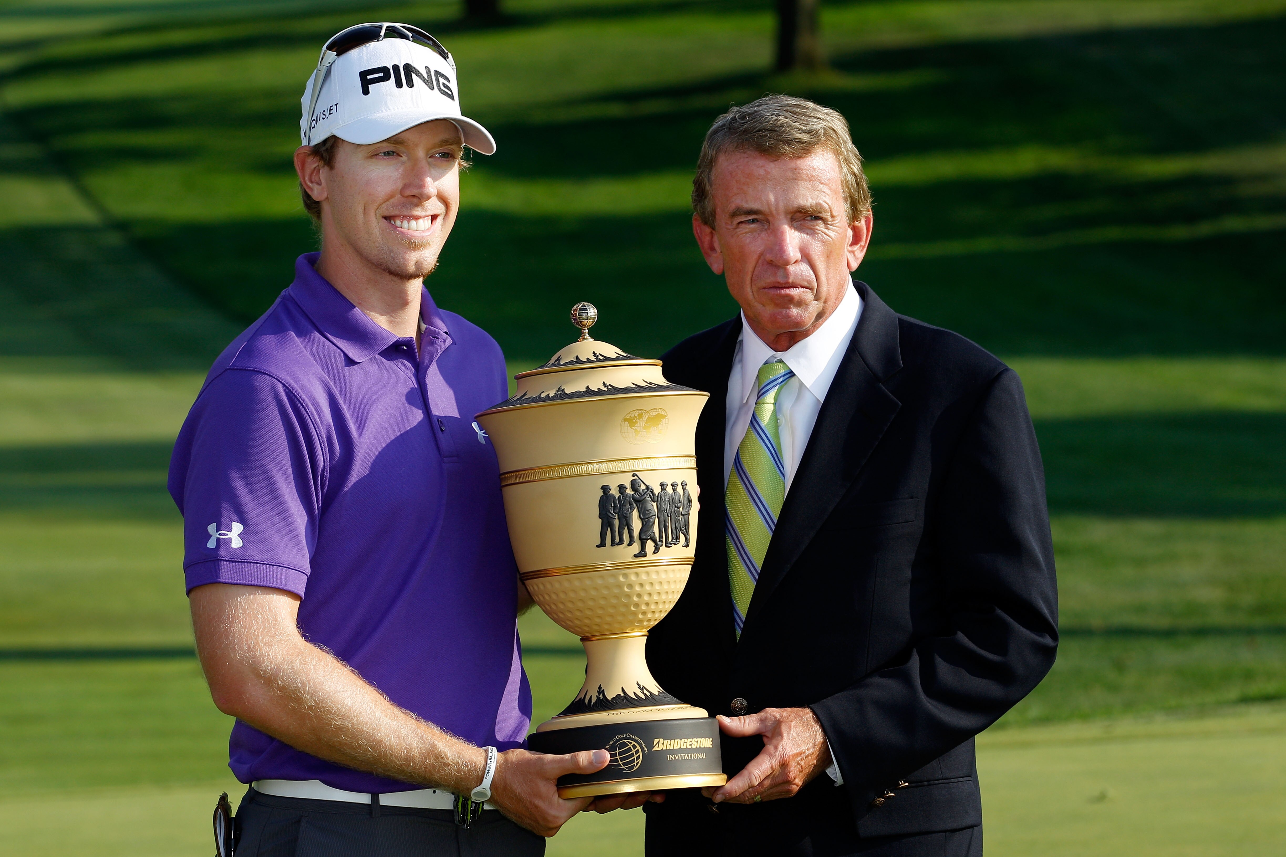 AKRON, OH - AUGUST 08: (L-R) Hunter Mahan smilles while holding the Gary Player Cup alongside PGA TOUR Commissioner, Tim Finchem, after winning the World Golf Championships - Bridgestone Invitational on the South Course at Firestone Country Club on August