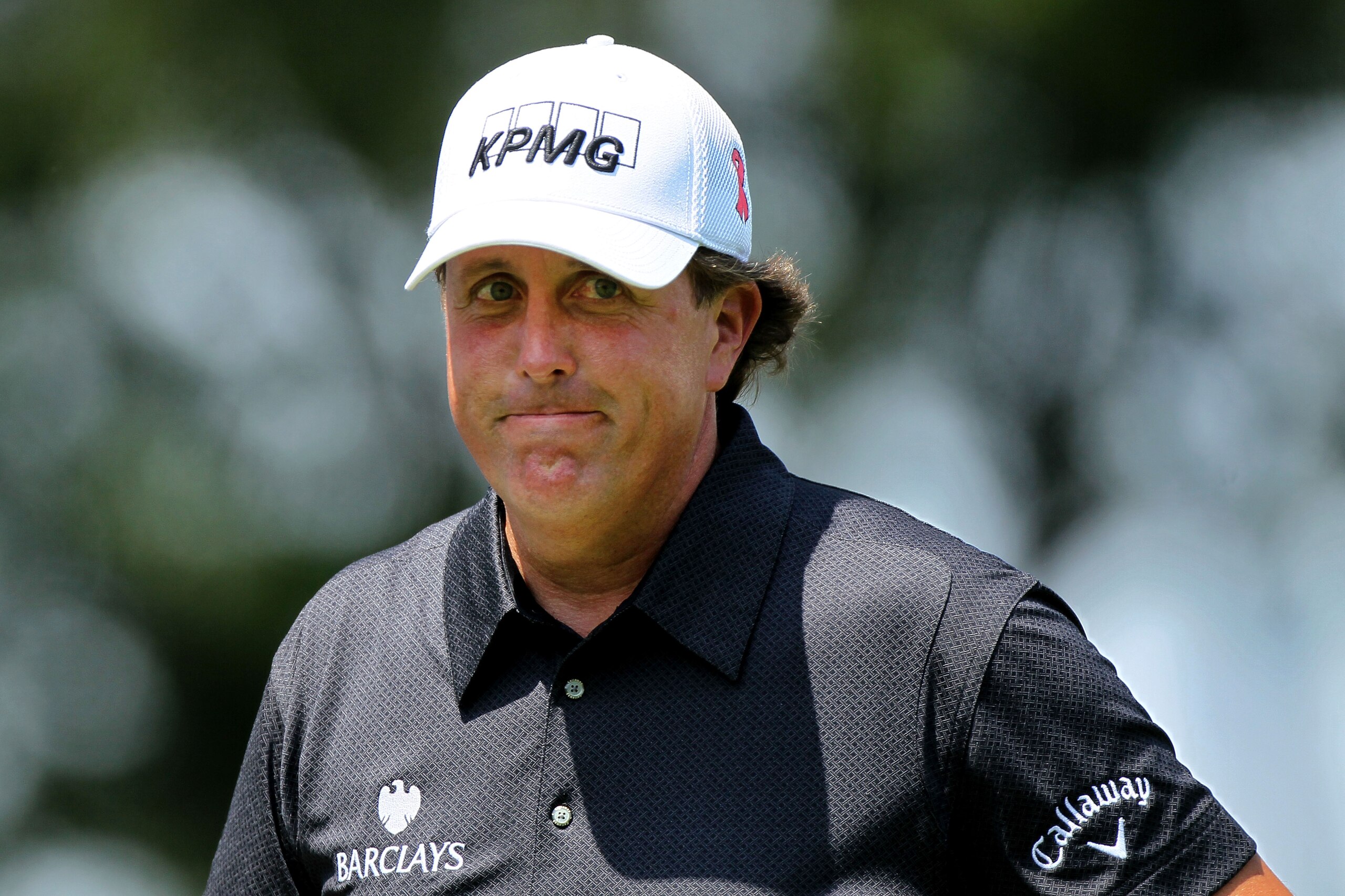 AKRON, OH - AUGUST 08:  Phil Mickelson smiles before hitting his tee shot on the third hole during the final round of the World Golf Championships - Bridgestone Invitational on the South Course at Firestone Country Club on August 8, 2010 in Akron, Ohio.  