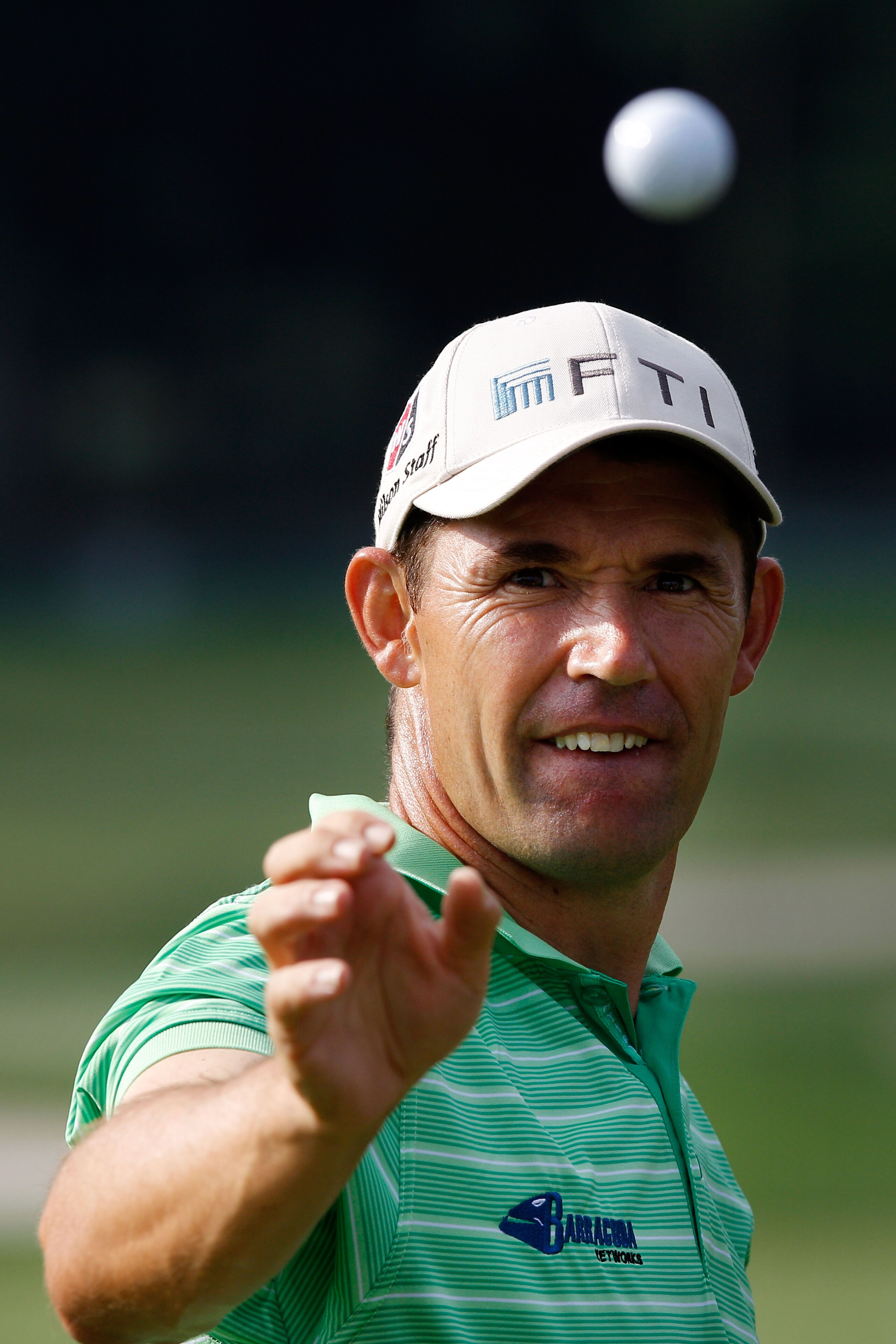 AKRON, OH - AUGUST 06:  Padraig Harrington of Ireland catches a ball on the practice range before the second round of the World Golf Championships - Bridgestone Invitational on the South Course at Firestone Country Club on August 6, 2010 in Akron, Ohio.  