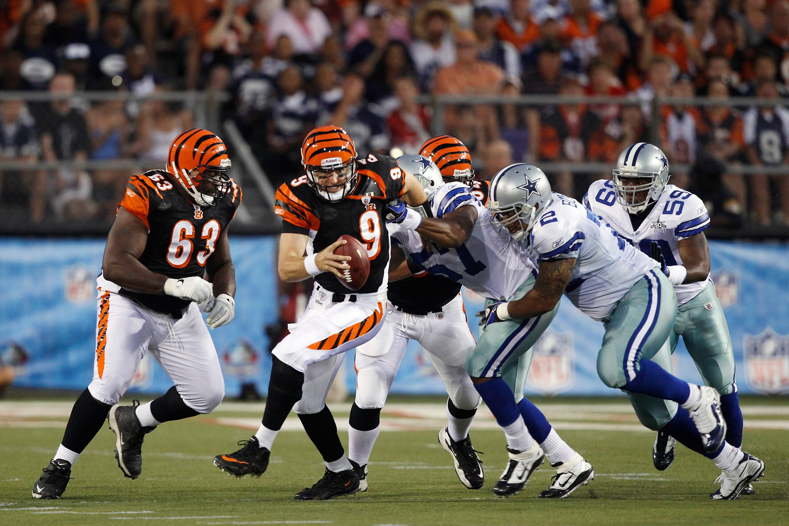 CANTON, OH - AUGUST 8: Victor Butler #57 and Stephen Brown #72 of the Dallas Cowboys sack Carson Palmer #9 of the Cincinnati Bengals during the 2010 Pro Football Hall of Fame Game at the Pro Football Hall of Fame Field at Fawcett Stadium on August 8, 2010