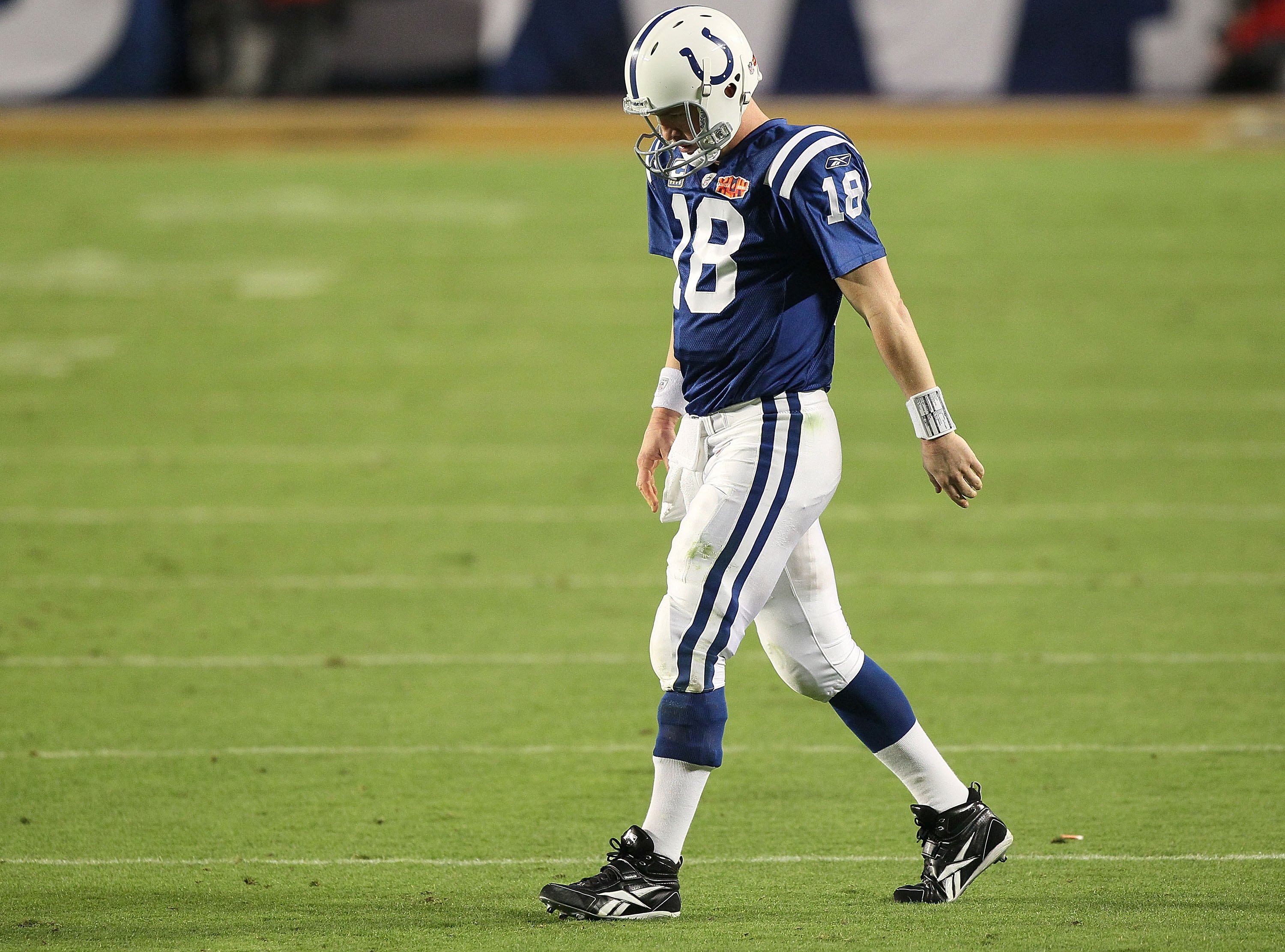 MIAMI GARDENS, FL - FEBRUARY 07:  Peyton Manning #18 of the Indianapolis Colts walks on the field against the New Orleans Saints during Super Bowl XLIV on February 7, 2010 at Sun Life Stadium in Miami Gardens, Florida.  (Photo by Jed Jacobsohn/Getty Image