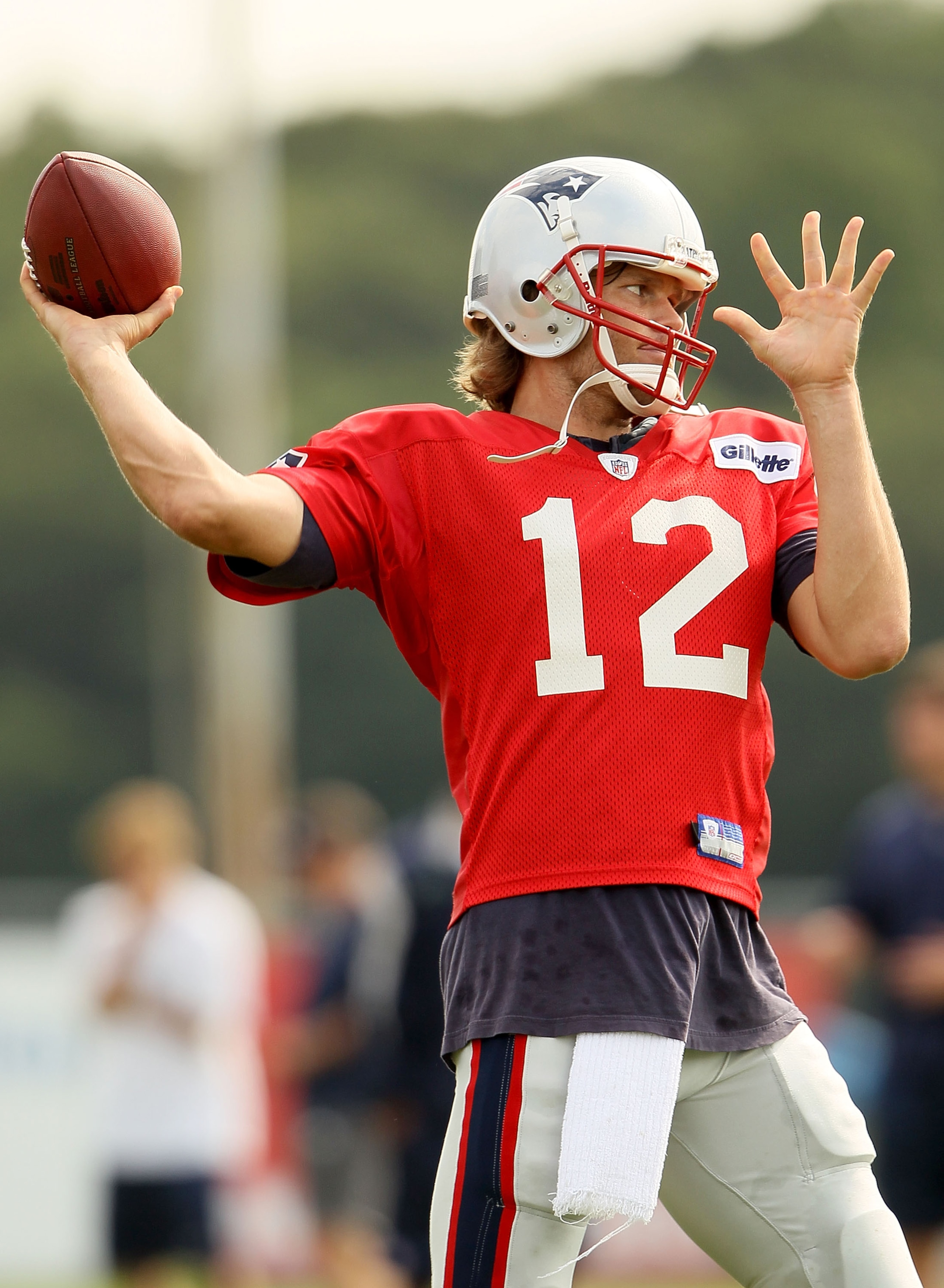 FOXBORO, MA - AUGUST 02: Quarterback Tom Brady #12 of the New England Patriots passes the ball during training camp on August 2, 2010 at Gillette Stadium in Foxboro, Massachusetts. (Photo by Elsa/Getty Images) FOXBORO, MA - AUGUST 02: Quarterback Tom Brady #12 of the New England Patriots passes the ball during training camp on August 2, 2010 at Gillette Stadium in Foxboro, Massachusetts. (Photo by Elsa/Getty Images)