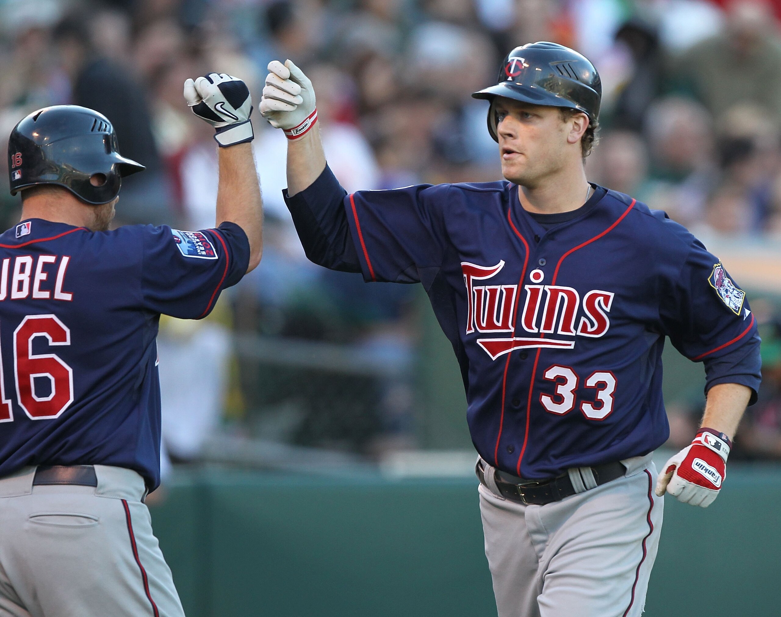 OAKLAND, CA - JUNE 04:  Justin Morneau #33 of the Minnesota Twins celebrates after hitting a two run home run against the Oakland Athletics in the first inning during an MLB game at the Oakland-Alameda County Coliseum on June 4, 2010 in Oakland, Californi
