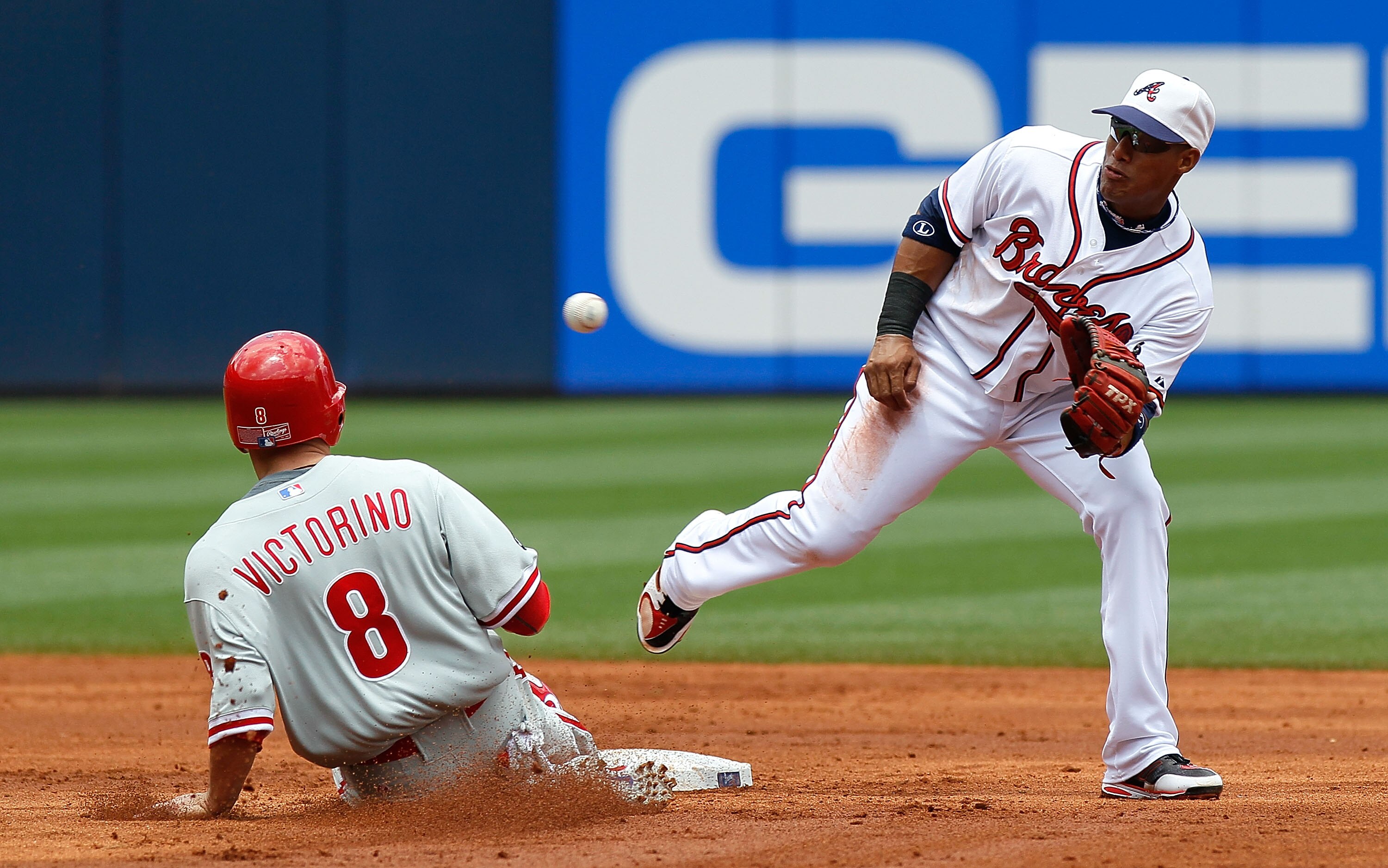 ATLANTA - MAY 31:  Shane Victorino #8 of the Philadelphia Phillies slides safely into second base against Yunel Escobar #19 of the Atlanta Braves at Turner Field on May 31, 2010 in Atlanta, Georgia.  (Photo by Kevin C. Cox/Getty Images)