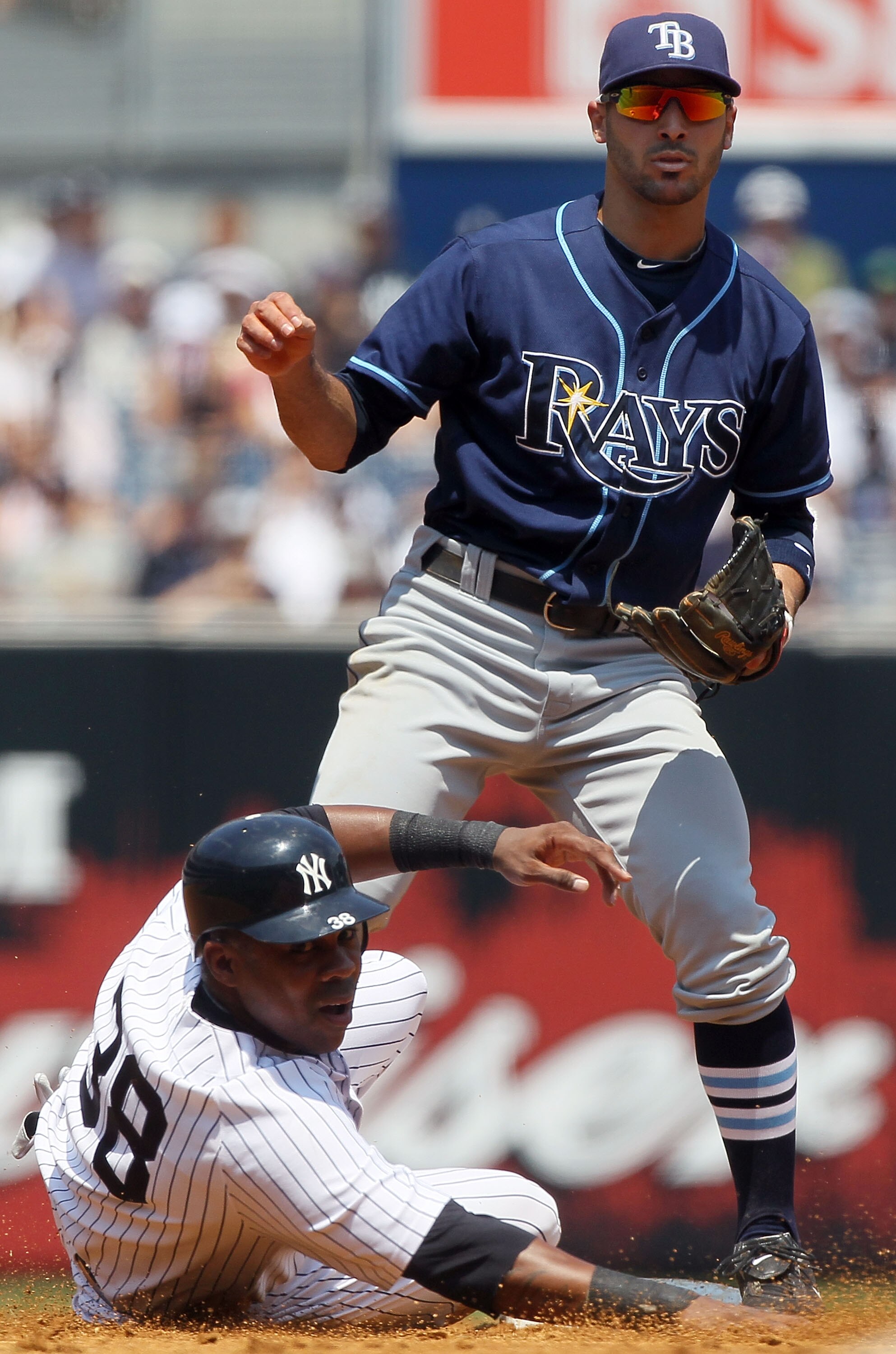 NEW YORK - JULY 18:  Sean Rodriguez #1 of the Tampa Bay Rays in action against Marcus Thames #38 of the New York Yankees on July 18, 2010 at Yankee Stadium in the Bronx borough of New York City.  (Photo by Jim McIsaac/Getty Images)