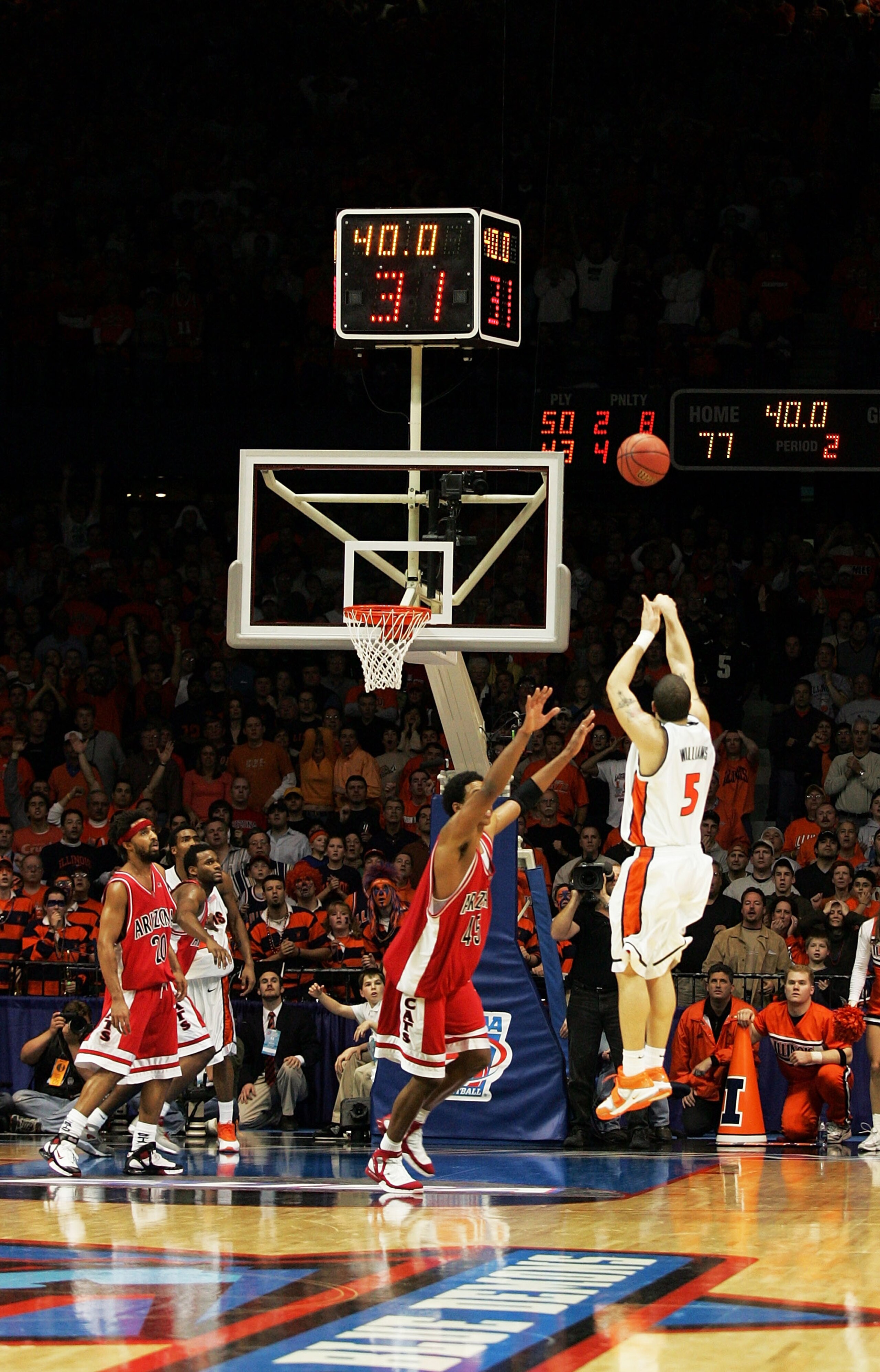 CHICAGO - MARCH 26: Channing Frye #45 of the Arizona Wildcats rushes to cover as Deron Williams #5 of the Illinois Fighting Illini hits the game tying three point basket to send the game into overtime in the Chicago Regional Final in the NCAA Division I CHICAGO - MARCH 26: Channing Frye #45 of the Arizona Wildcats rushes to cover as Deron Williams #5 of the Illinois Fighting Illini hits the game tying three point basket to send the game into overtime in the Chicago Regional Final in the NCAA Division I