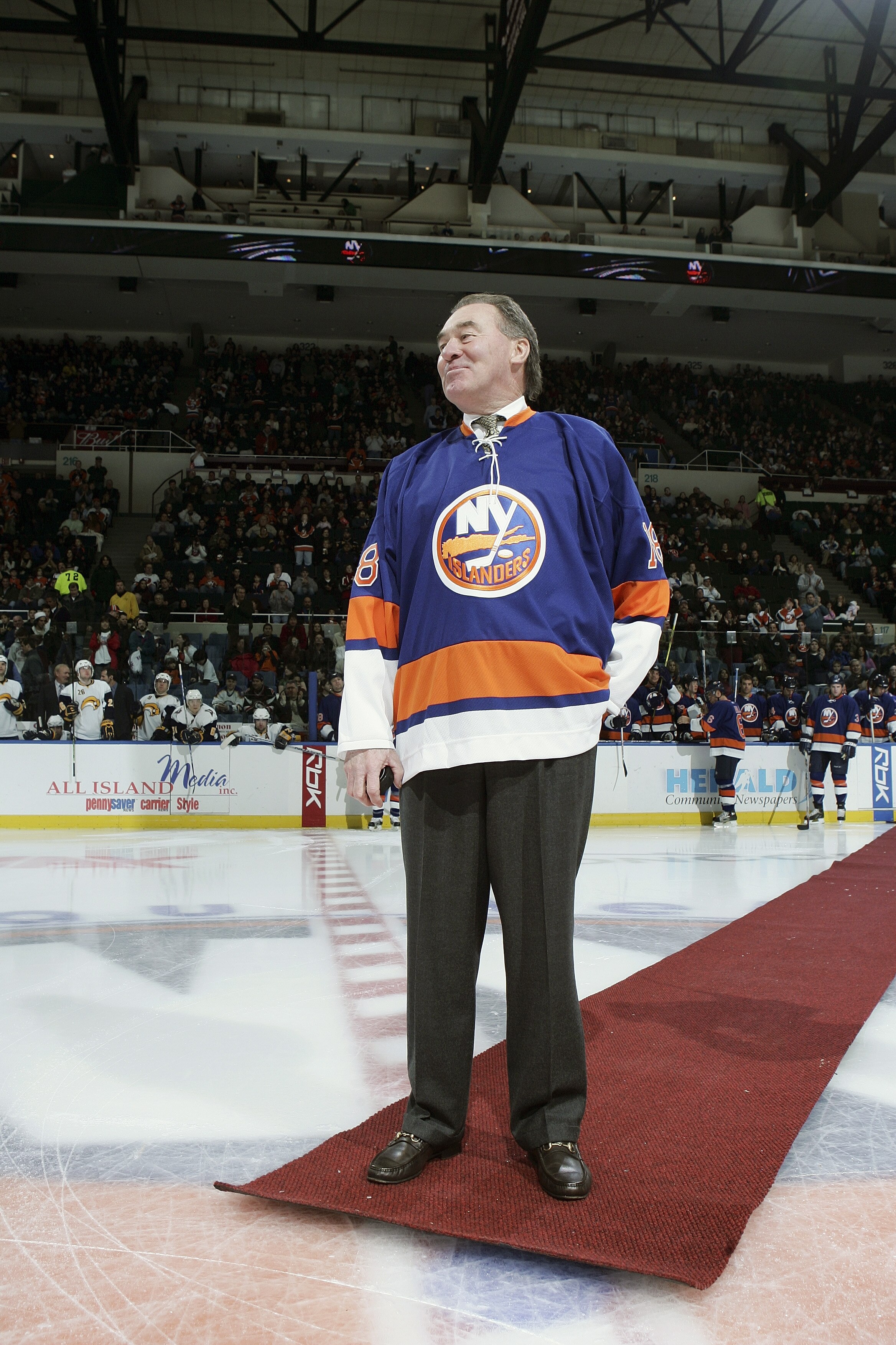 UNIONDALE, NY - JANUARY 27:  Former New York Islanders player Ed Westfall walks to center ice to drop the puck for the ceremonial opening face off before the game against the Buffalo Sabres on January 27, 2007 at Nassau Coliseum in Uniondale, New York. Th