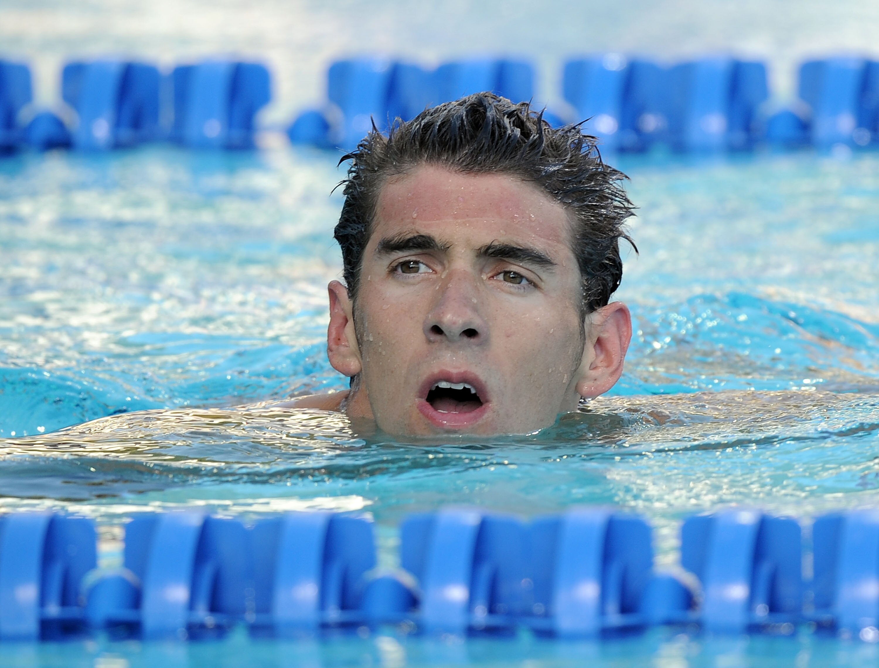 IRVINE, CA - AUGUST 07:  Michael Phelps reacts after his swim in the 200 LC Meter Backstroke Final during the 2010 ConocoPhillips National Championships at the William Woollett Jr. Aquatics Complex on August 7, 2010 in Irvine, California. Phelps finished