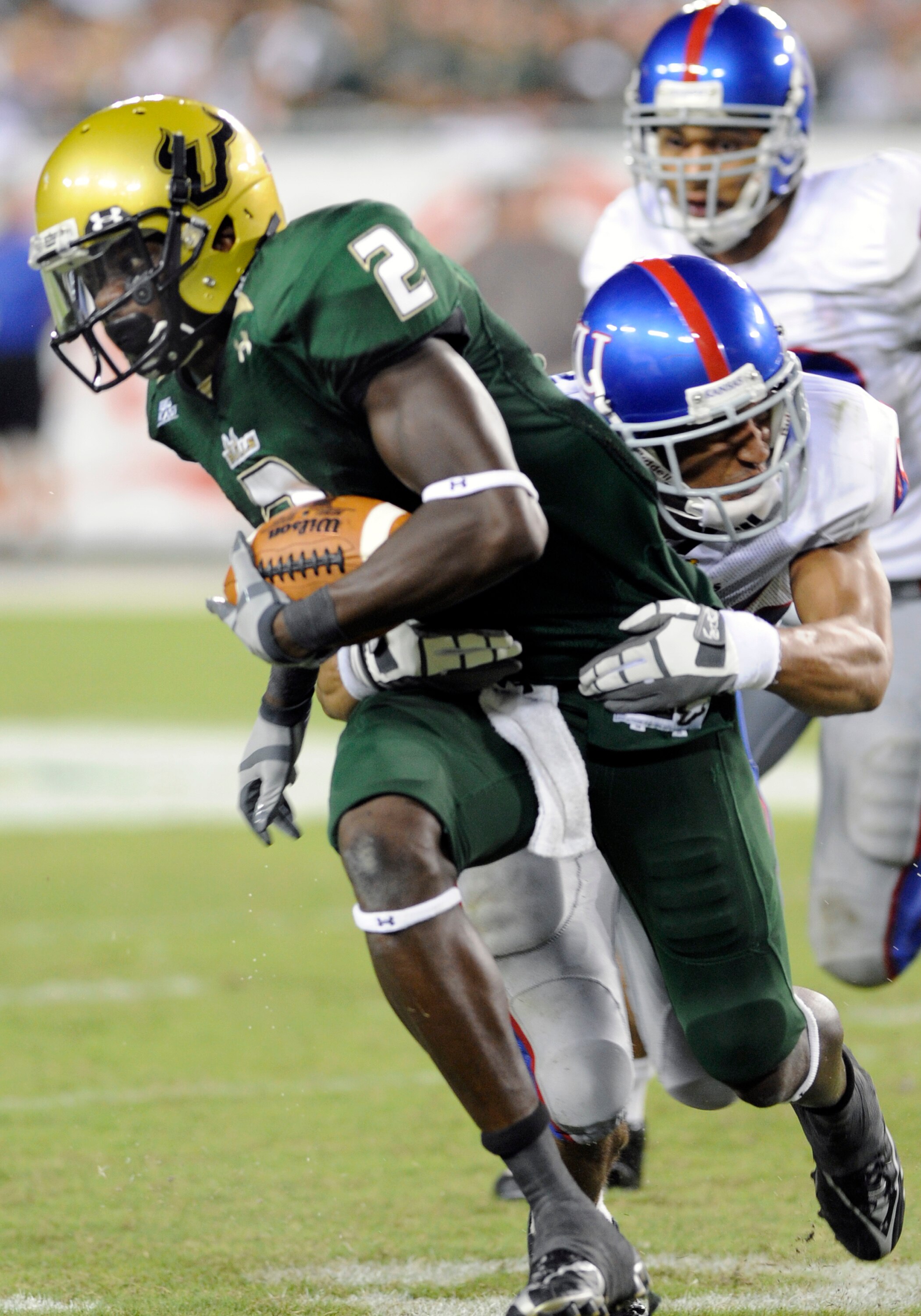 TAMPA, FL - SEPTEMBER 12: Wide receiver Carlton Mitchell #2 of the University of South Florida Bulls rushes upfield with a pass against the Kansas University Jayhawks at Raymond James Stadium on September 12, 2008 in Tampa, Florida.  (Photo by Al Messersc
