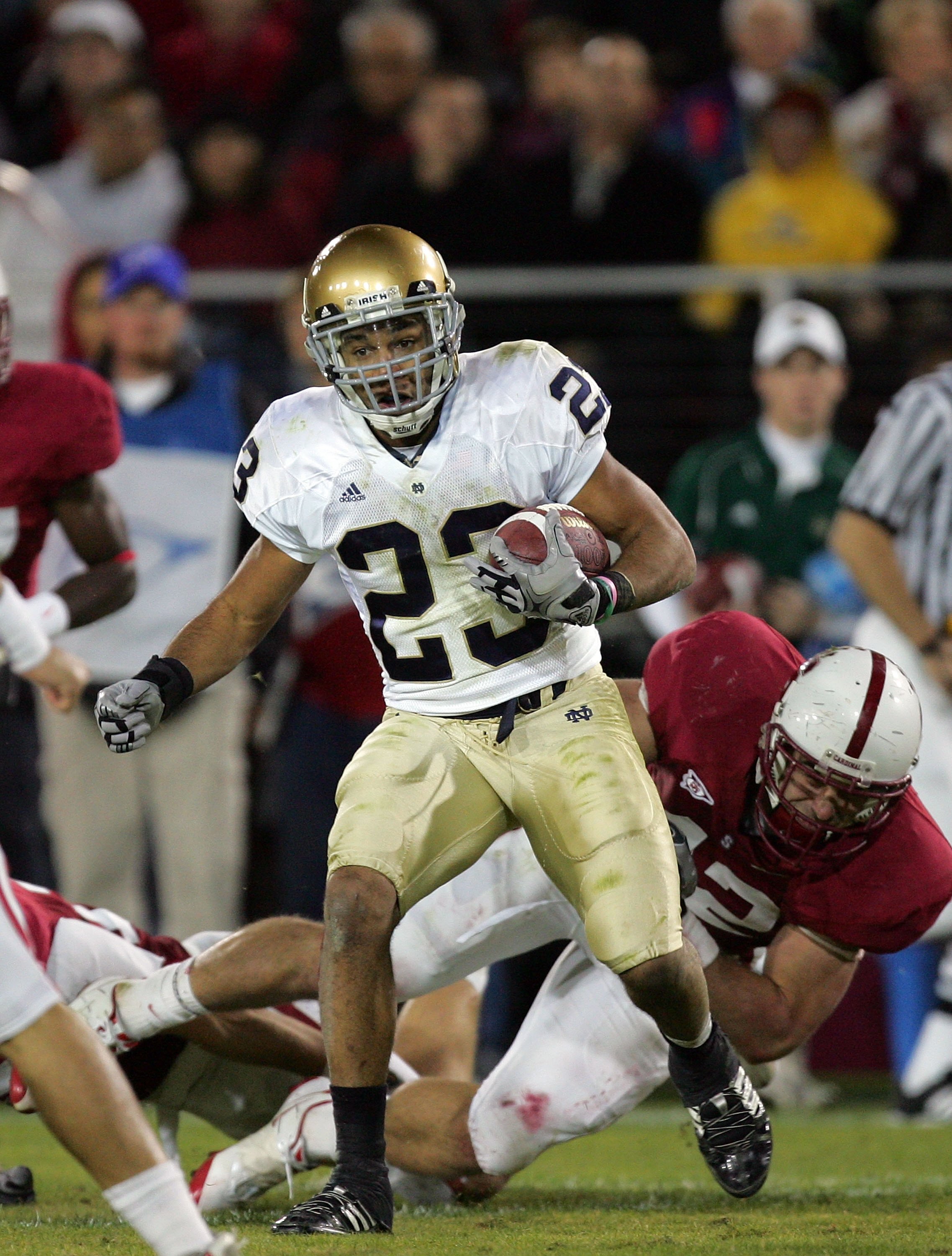PALO ALTO, CA - NOVEMBER 28:  Golden Tate #23 of the Notre Dame Fighting Irish runs with the ball during their game against the Stanford Cardinal at Stanford Stadium on November 28, 2009 in Palo Alto, California.  (Photo by Ezra Shaw/Getty Images)