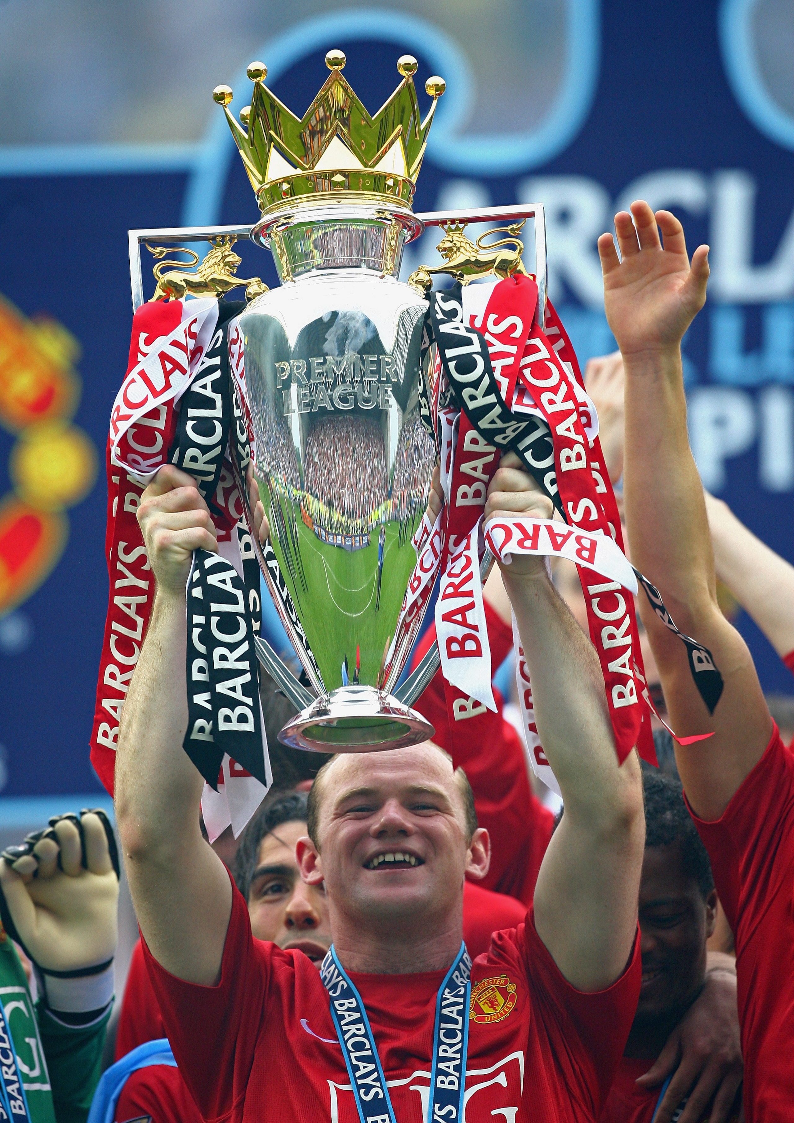 WIGAN, UNITED KINGDOM - MAY 11:  Wayne Rooney of Manchester United lifts the Barclays Premier League Trophy after the Barclays Premier League match between Wigan Athletic and Manchester United at the JJB Stadium on May 11, 2008 in Wigan, England.  (Photo 