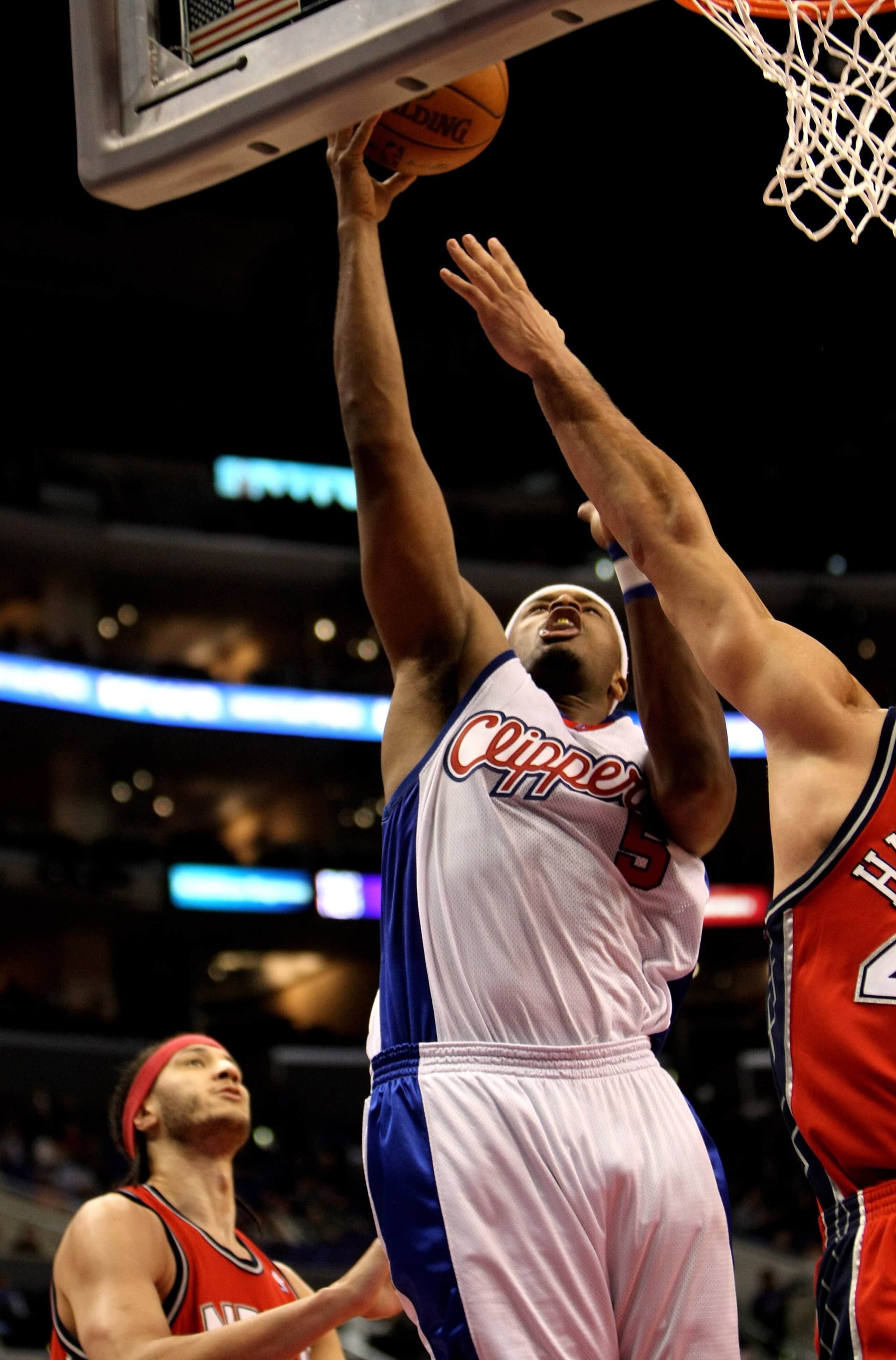 LOS ANGELES - JANUARY 18: Craig Smith #5 of the Los Angeles Clippers shoots against the the New Jersey Nets on January 18, 2010 at Staples Center in Los Angeles, California. The Clippers won 106-95. NOTE TO USER: User expressly acknowledges and agrees t LOS ANGELES - JANUARY 18: Craig Smith #5 of the Los Angeles Clippers shoots against the the New Jersey Nets on January 18, 2010 at Staples Center in Los Angeles, California. The Clippers won 106-95. NOTE TO USER: User expressly acknowledges and agrees t