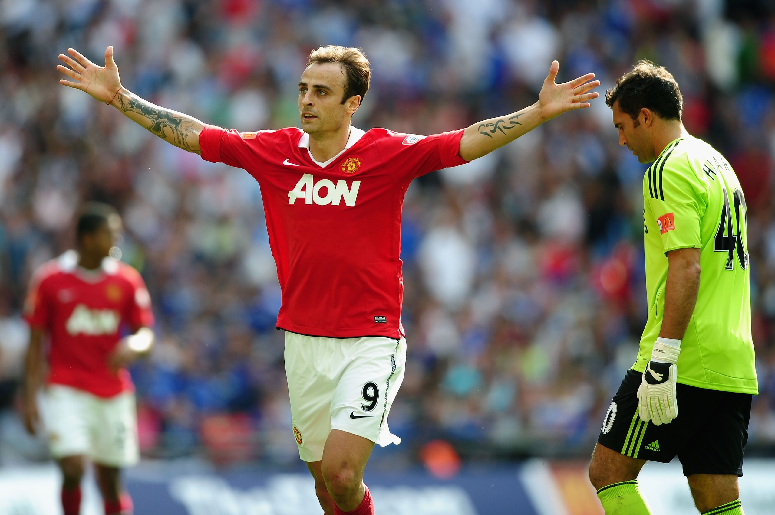 LONDON, ENGLAND - AUGUST 08:  Henrique Hilario of Chelsea (R) looks dejected as Dimitar Berbatov of Manchester United celebrates as he scores their third goal during the FA Community Shield match between Chelsea and Manchester United at Wembley Stadium on