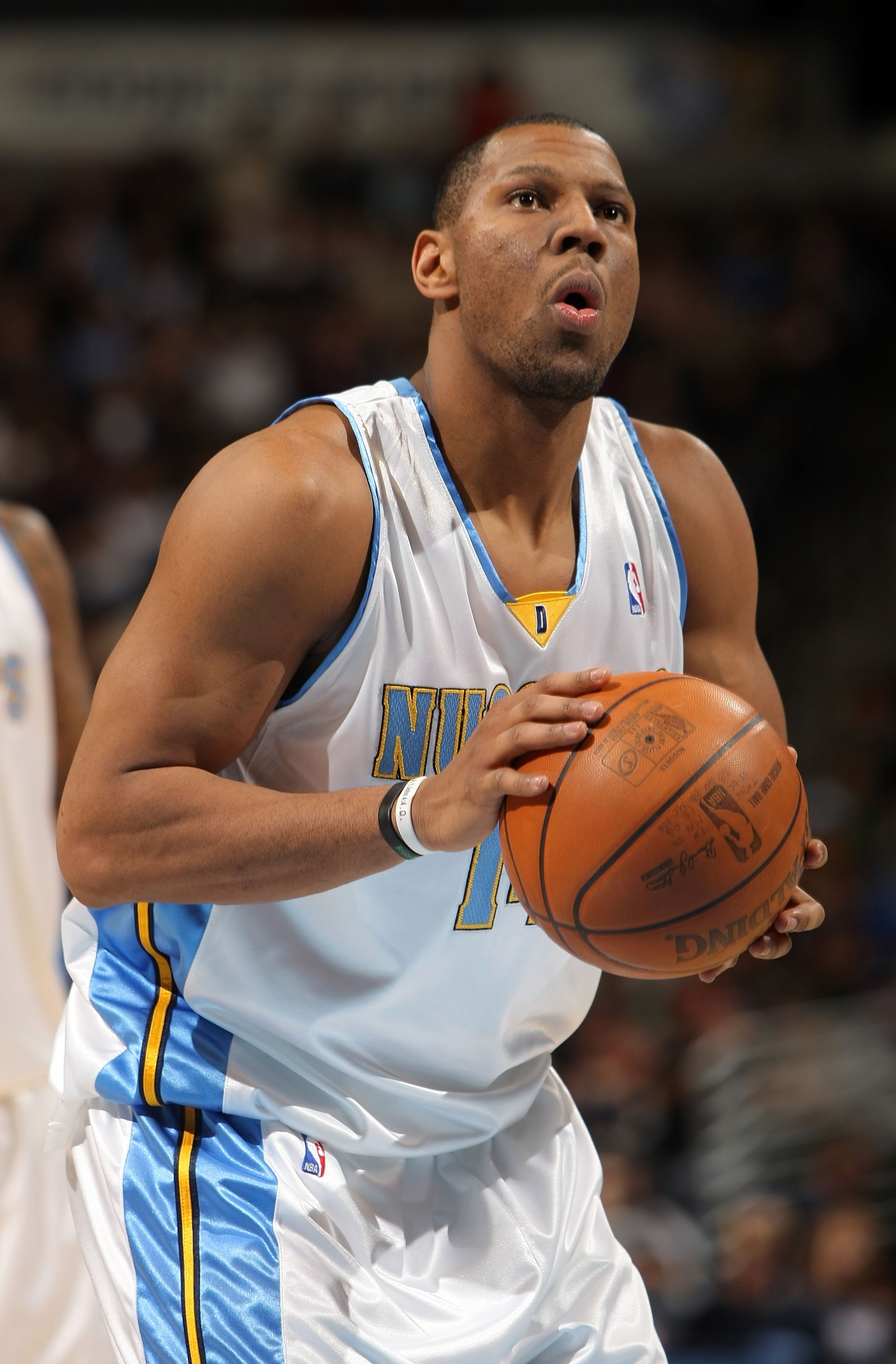 DENVER - JANUARY 05:  Joey Graham #14 of the Denver Nuggets takes a free throw against the Golden State Warriors at the Pepsi Center on January 5, 2010 in Denver, Colorado. The Nuggets defeated the Warriors 123-122. NOTE TO USER: User expressly acknowledg