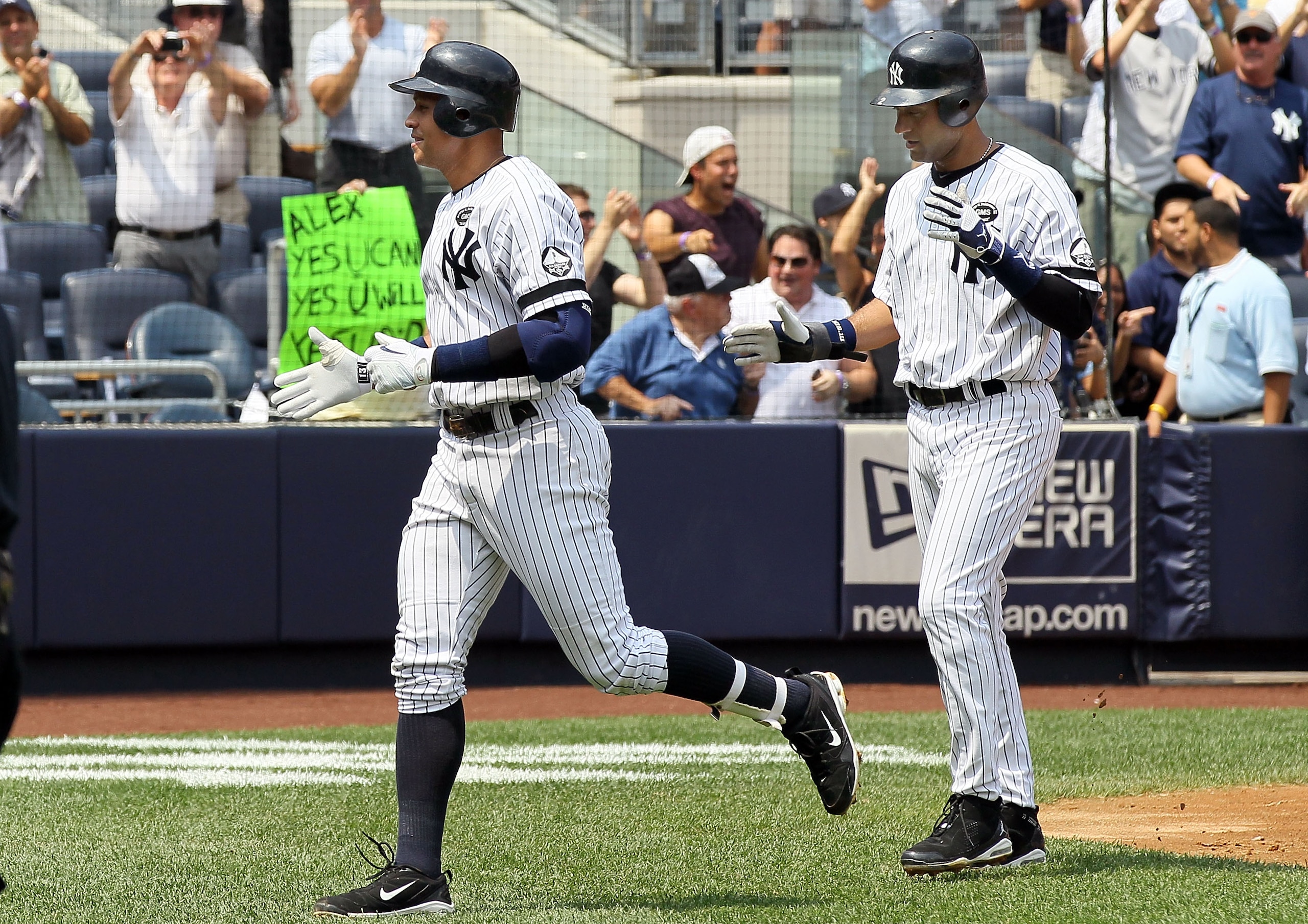 NEW YORK - AUGUST 04:  Alex Rodriguez #13 of the New York Yankees celebrates his 600th career home run in the first inning against the Toronto Blue Jays with teammate Derek Jeter #2 on August 4, 2010 at Yankee Stadium in the Bronx borough of New York City
