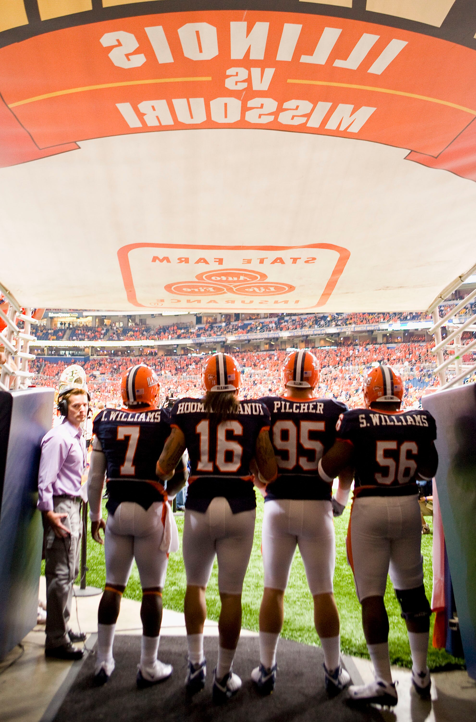 ST. LOUIS, MO - SEPTEMBER 5: Juice Williams #7, Michael Hoomanawanui #16, Doug Pilcher #95 and Sirod Williams #56 all of the University of Illinois Fighting Illini wait to take the field against the University of Missouri Tigers during the State Farm Arch