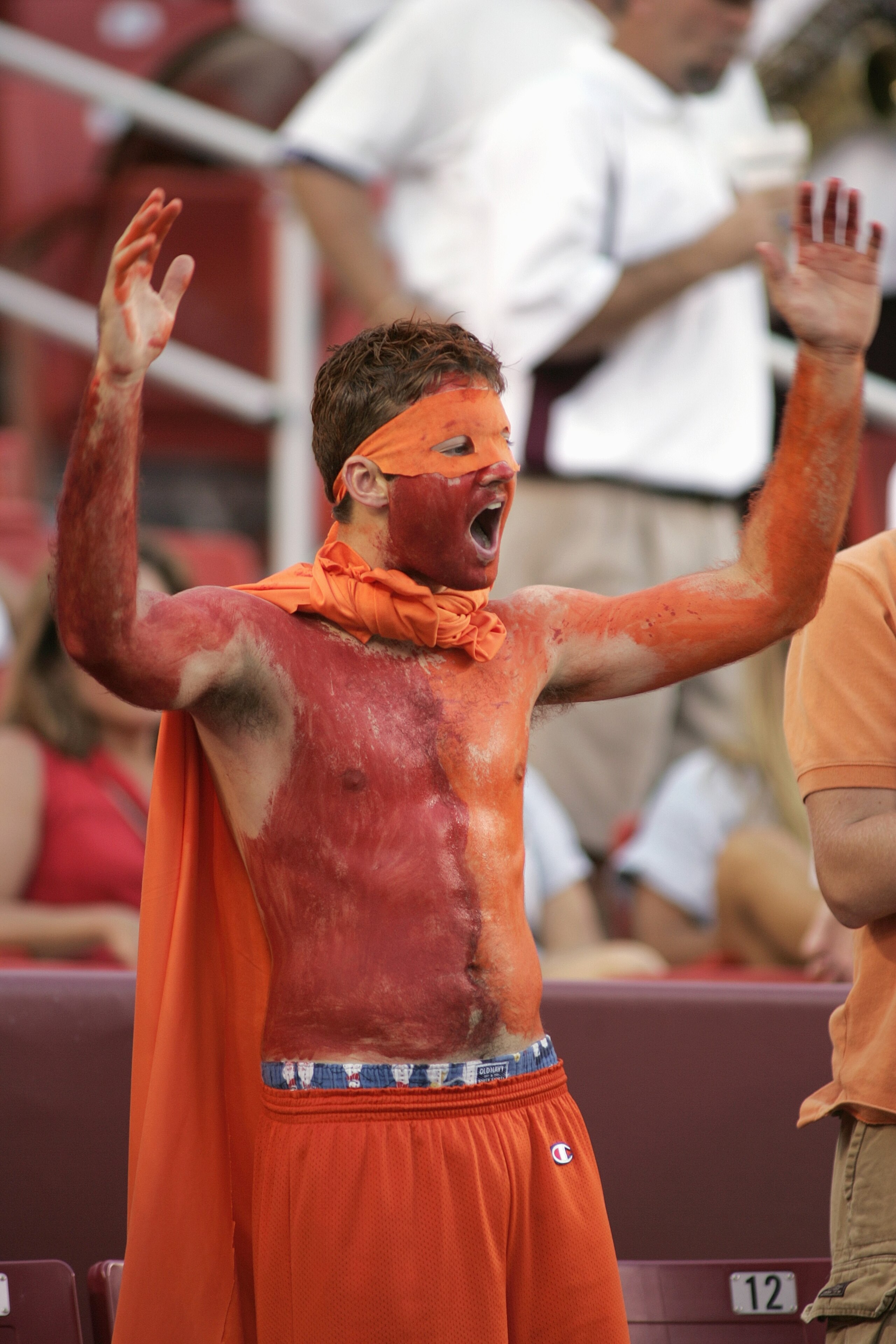 LANDOVER, MD - AUGUST 28:  A painted fan of the Virginia Tech Hokies cheers for his team during the Black Coaches Association Football Classic against the University of Southern California Trojans on August 28, 2004 at FedEx Field in Landover, Maryland.