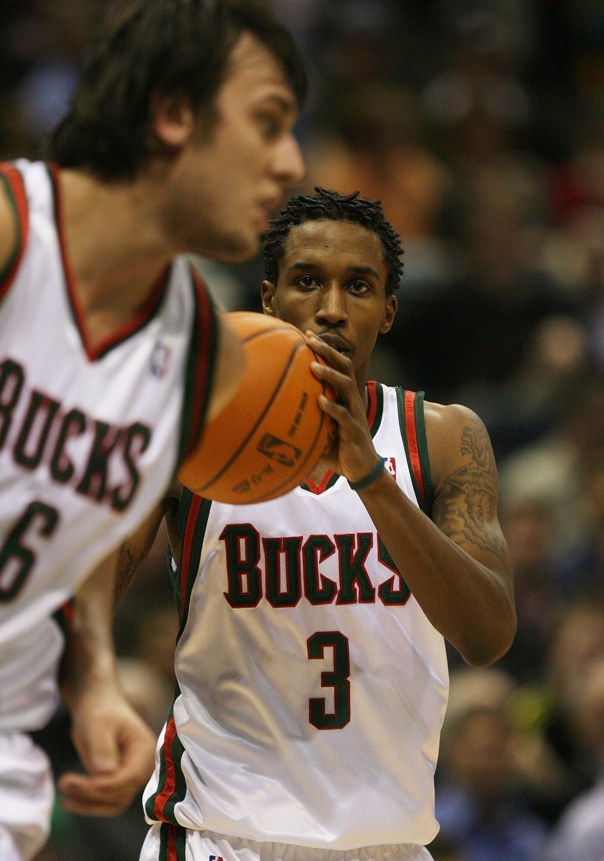 MILWAUKEE - NOVEMBER 16: Brandon Jennings #3 of the Milwuakee Bucks looks to pass to teammate Andrew Bogut #6 against the Dallas Mavericks at the Bradley Center on November 16, 2009 in Milwaukee, Wisconsin. The Mavericks defeated the Bucks 115-113 in over